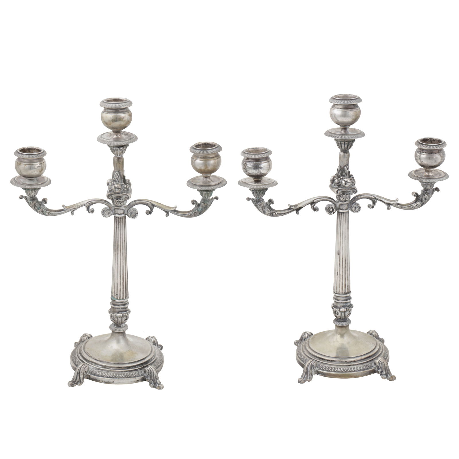 Alessandria circa 1960 by Baggio A pair of mid-20th century Italian 800 standard silver candelabra: Alessandria circa 1960 by Baggio A pair of mid-20th century Italian 800 standard silver candelabra Circular bases with scroll feet, fluted columns with scroll branches, three capitals. Marked to