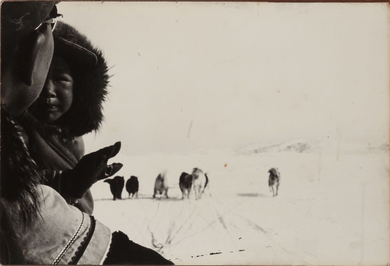 Charles Gimpel (1913-1973) Canada and the Inuit Nation, c.1964-1965: A group of 5 silver gelatin exhibition prints [Smithsonian Institute], flush-mounted to thick wooden backboard, comprising: Boy on Swing, overall measuring 49.5 x33.5cm, with a vintage Gimpel Fils gal