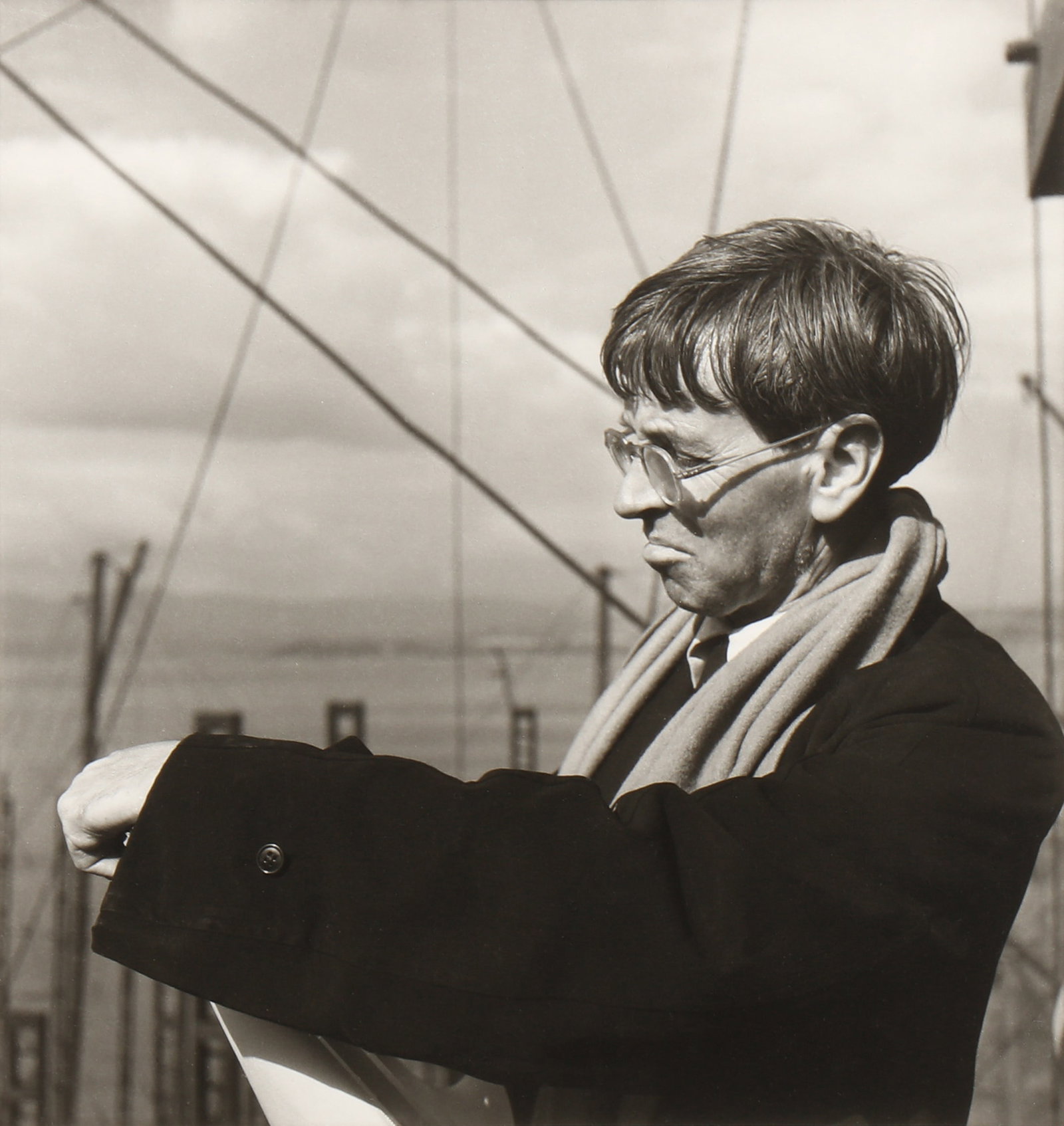 William MacQuitty (1905-2004) War Artist Stanley Spencer sketching in the Clyde Shipyards, 1943: Silver gelatin print, printed later, image size 29 x 27.2cm, sheet size 40.2 x 30.3cm, signed by the photographer in felt-tip pen, lower right margin recto, titled, dated, and signed by the photograph