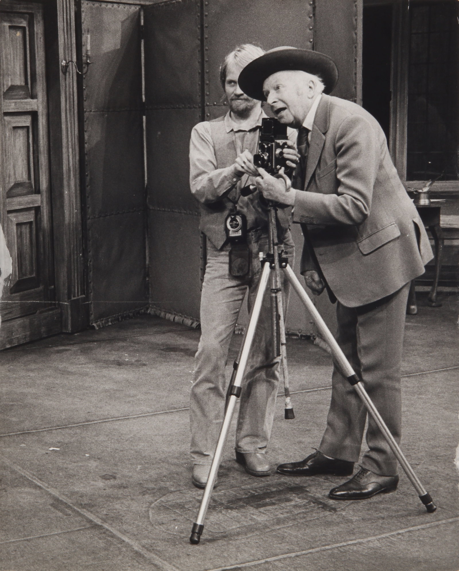 Photographer Unknown (XX) Cecil Beaton on Set, c.1975: A group of four vintage press prints featuring Cecil Beaton (1904-1980) on the set of a theatrical performance, three measuring 25 x 17cm, one measuring 25.5 x 20.5, each with Rex Features distributio