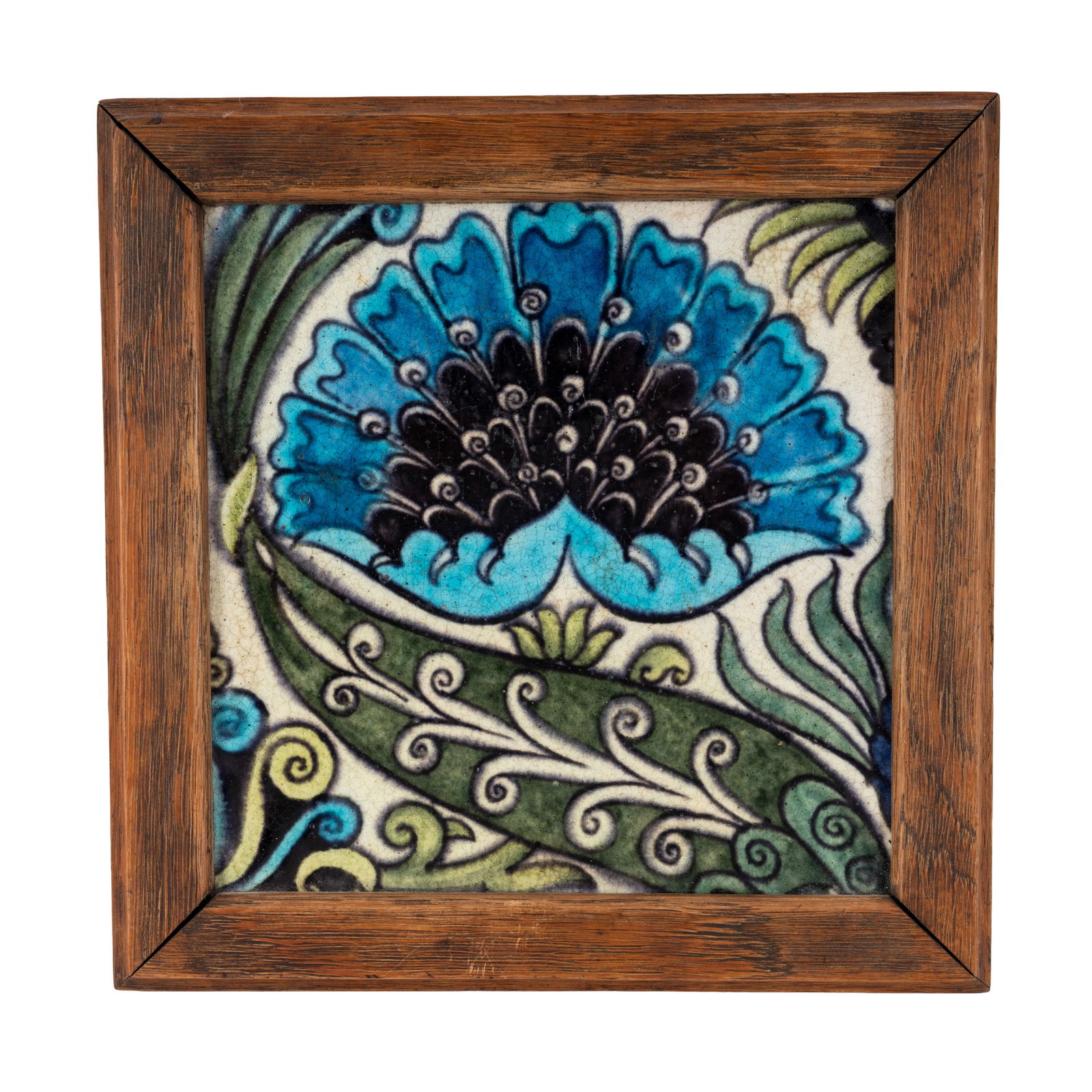 William de Morgan (British 1839-1917) 'BBB' tile in wooden frame: Circa 1880 Painted and glazed earthenware, wooden frame Verso concealed by framing and felt 19 x 19.5cm