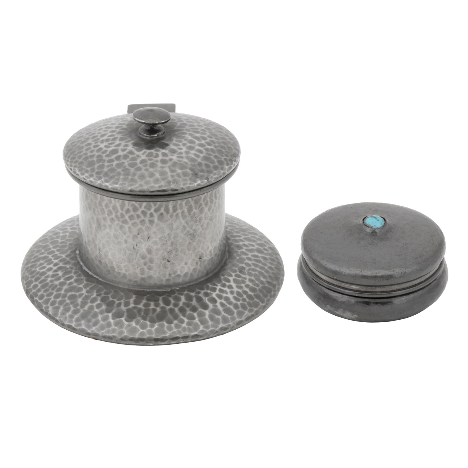 Liberty and Co, British 'Tudric' inkwell, model no. 01135, and a snuff box inset with turquoise: Circa 1905 Pewter, enamel, turquoise Impressed stamps to underside, snuff box stamped '0904' Model 01135: 11.2cm diameter, 8cm high, Snuff box: 6cm diameter (2)