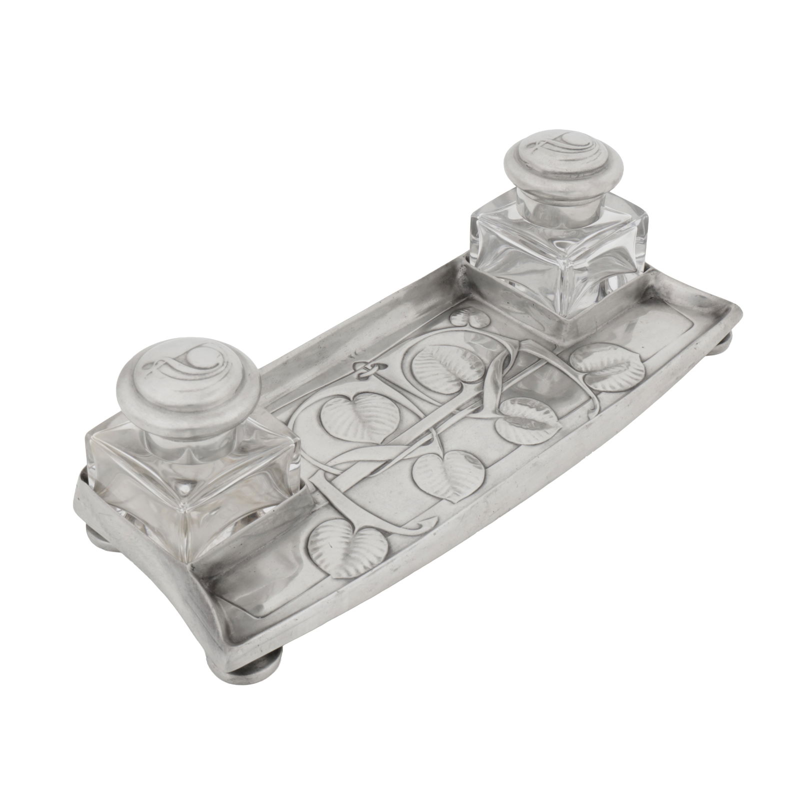 Archibald Knox (British 1864-1933) for Liberty and Co 'Tudric' combined inkwell and pentray with two: Circa 1905 Pewter, glass Underside stamped 'TUDRIC', 'MADE IN ENGLAND', model number and Solkets mark 26 x 9 x 7cm high