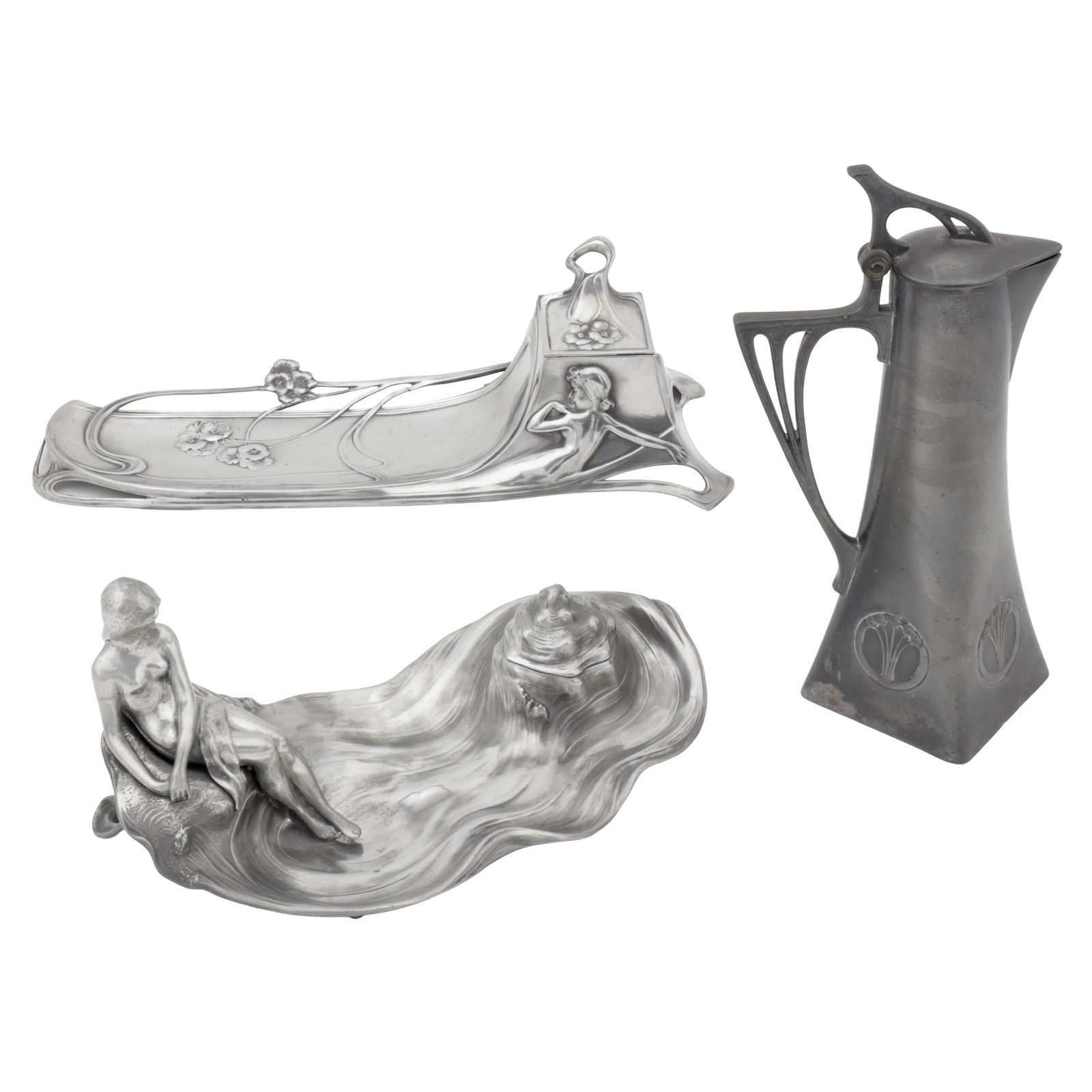 WMF, German Two Art Nouveau inkwells, and a claret jug: Circa 1900 Pewter Various stamped numbers Claret jug: 22.5cm high, Inkwell model 91: 22cm wide, Inkwell to the rear in image: 29.5cm wide