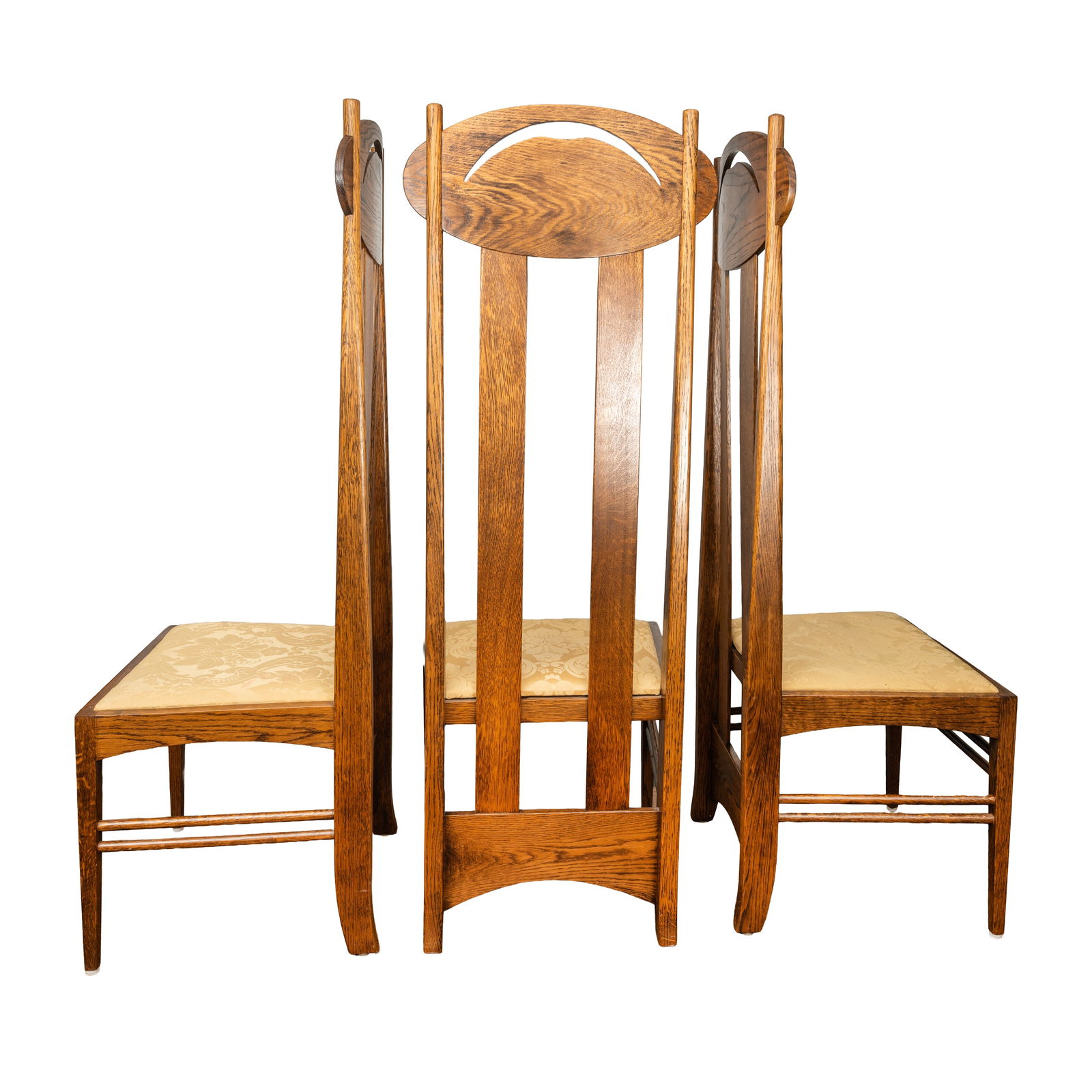 In the Manner of Charles Rennie Mackintosh (Scottish 1868-1928) Set of 8 'Argyle' style chairs: Contemporary Manufactured by Freud, London Stained Oak, butter yellow upholstery Unmarked 138cm high x 50cm wide x 45cm deep