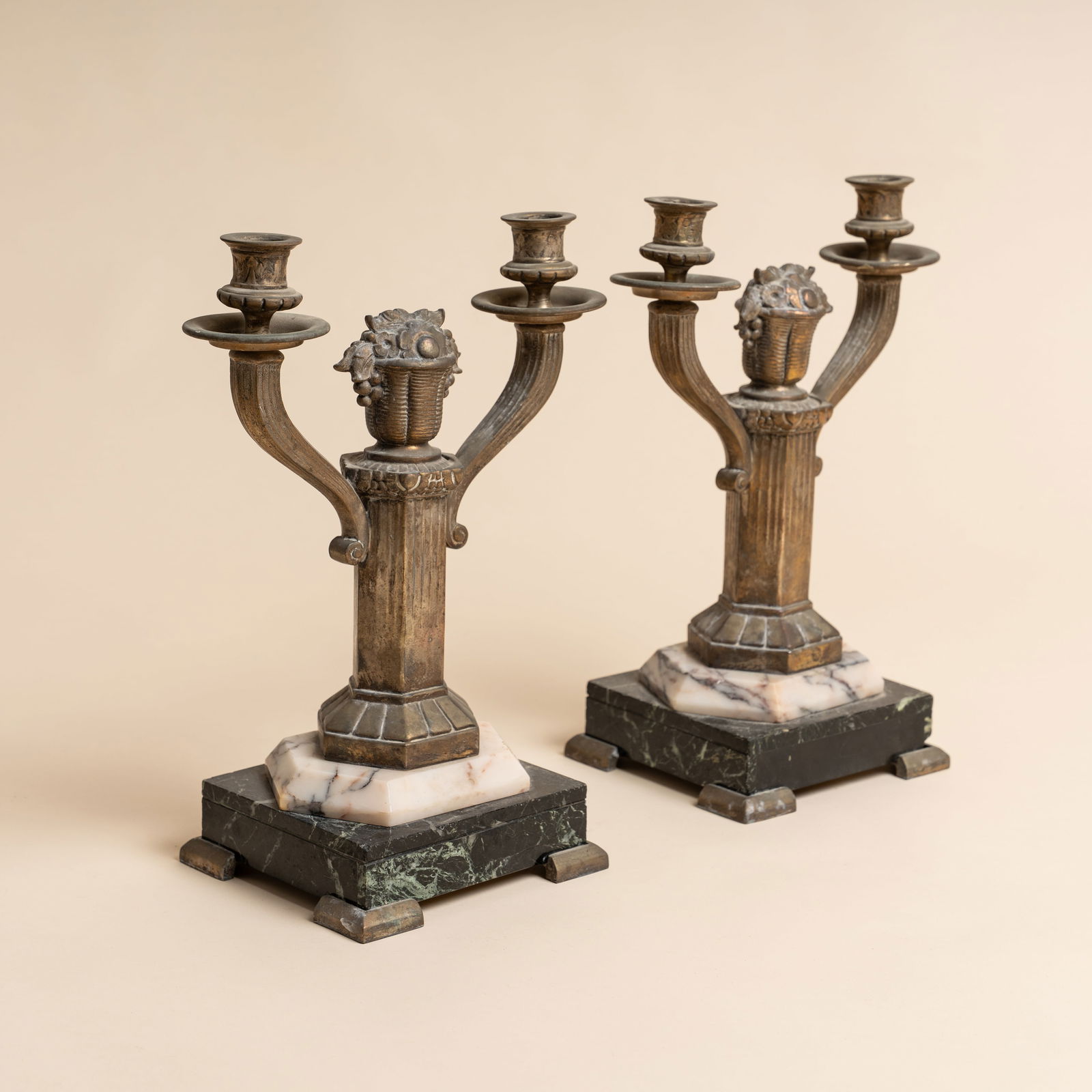 Art Deco, Europe Pair of Neo-classical style two-branch candelabra: Circa 1920s Brass, onyx and alabaster base 33cm high x 26cm wide x 15cm deep Provenance:From a private collection, London