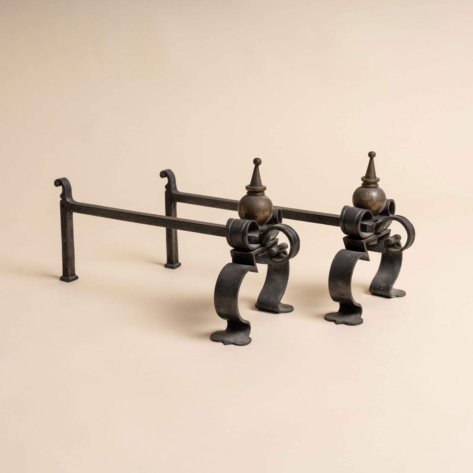 Arts and Crafts, Britain Pair of Fire Dogs: Late 19th / early 20th century Iron, brass 26cm high x 20cm wide x 49cm long Provenance:From a private collection, London