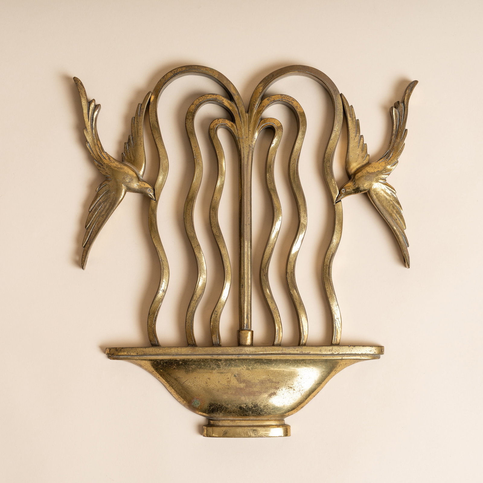 Manner of Walter Gilbert (British 1871-1946) Wall sconce modelled as swallows in flight and fountain: Circa 1900 Cast brass 30cm high Provenance:From a private collection, London