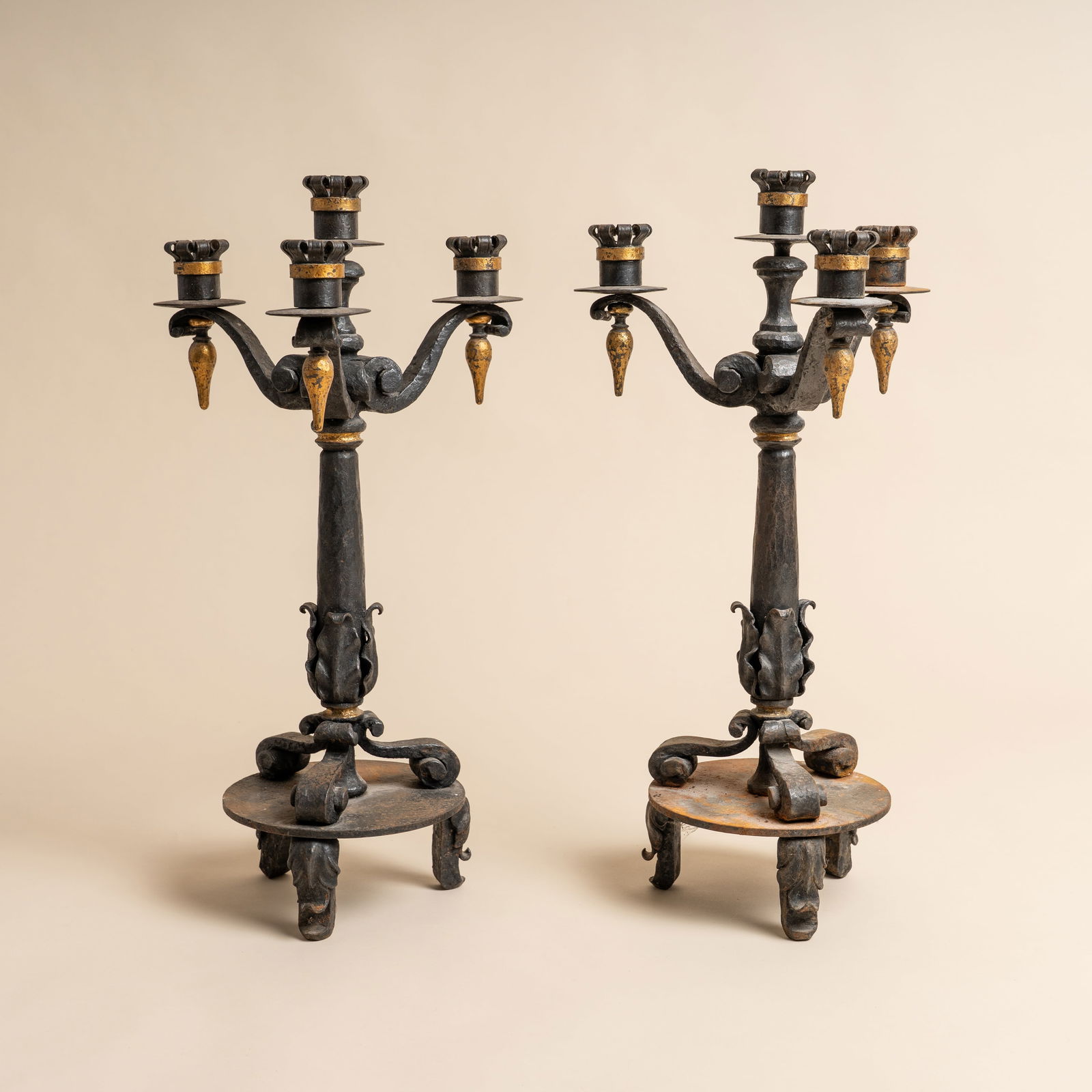 Arts and Crafts, Europe Pair of Three-Sconce Candelabra: Gothic Revival, circa 1930s Wrought iron, gilt 55cm high Provenance:From a private collection, London
