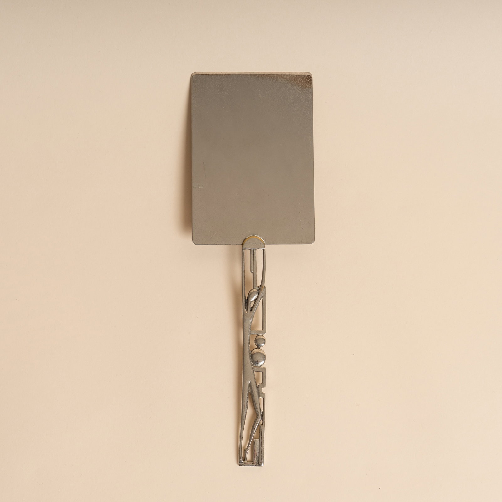 In the manner of Hagenauer for Wiener Werkstätte Cake Slice or server: Circa 1930s Nickel-plated brass 29cm long Provenance:From a private collection, London