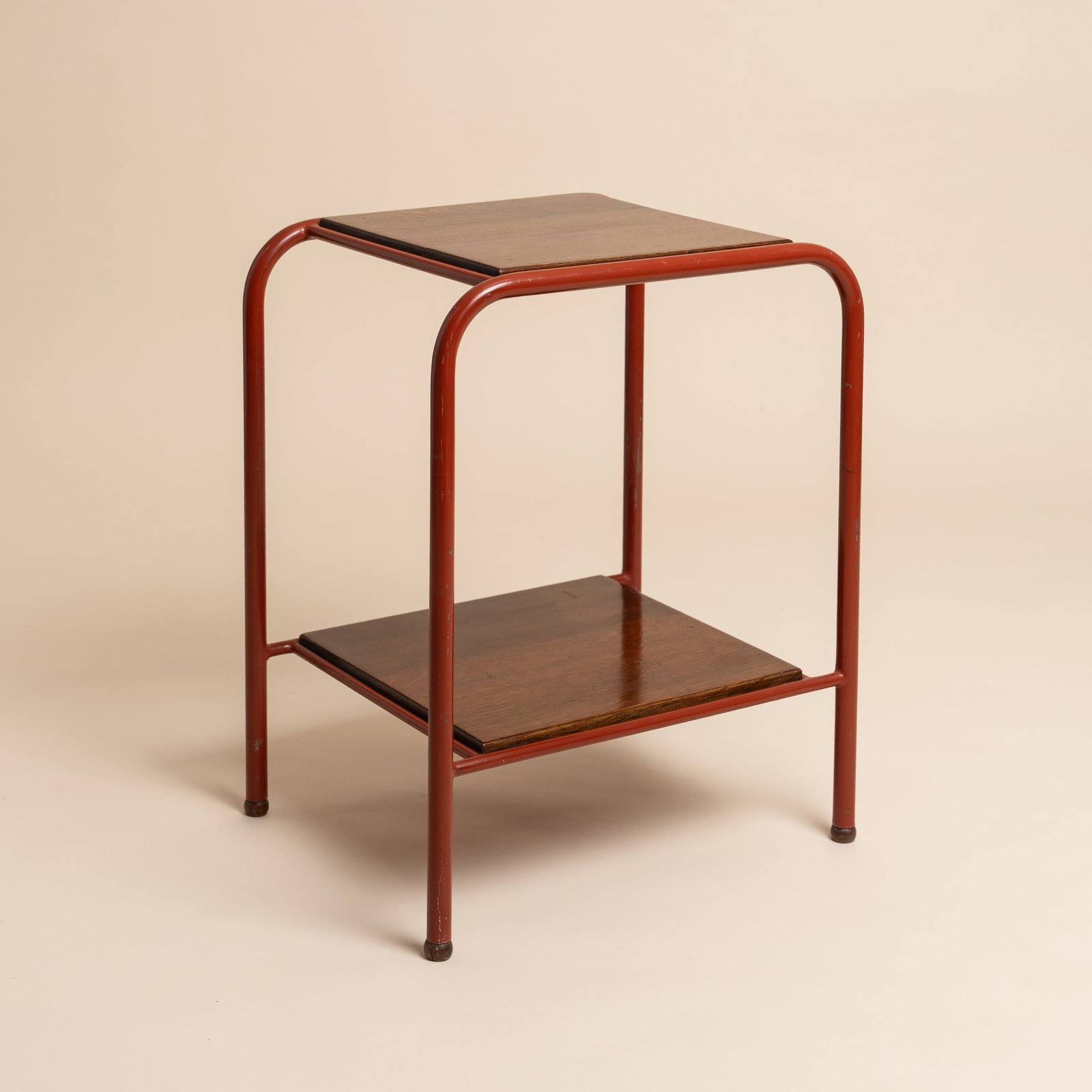 Jules Leleu (French 1883-1961) for Atelier Jean Prouve Occasional table for Martel de Janville: Circa 1935 Lacquered metal, oak shelves Unmarked 62cm high x 49cm wide x 39cm deep Provenance:The collection of Mo Amelia Teitelbaum Mo is a collector, researcher and author who specialises in the per