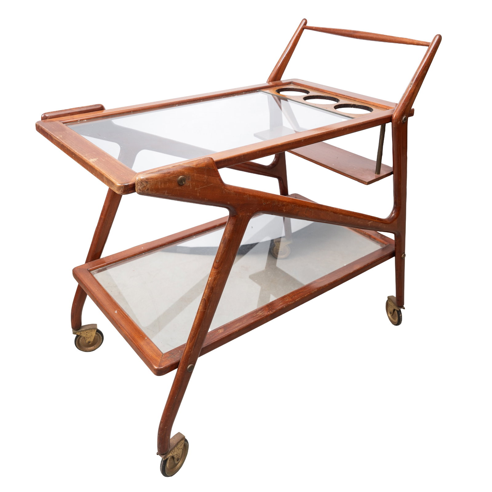 Cesare Lacca (Italian, b.1929) Bar cart or trolley: 1950s Cherrywood, glass 80cm high x 82cm wide x 41cm deep Provenance:From a private Italian collection