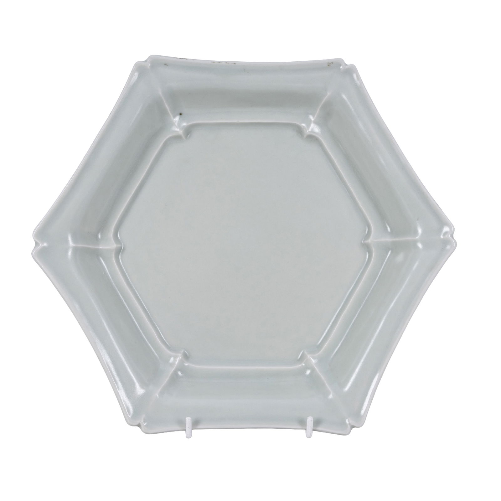 Ueda Tsuneji (Japanese 1814-1987) (attributed) Celadon hexagonal dish: 20th century Clear glazed porcelain Unsigned, historic auction house label to underside 27cm wide maximum Notes: Similar Sake set based on Choson-period Korean white porcelain sold at Christies 15 Oct