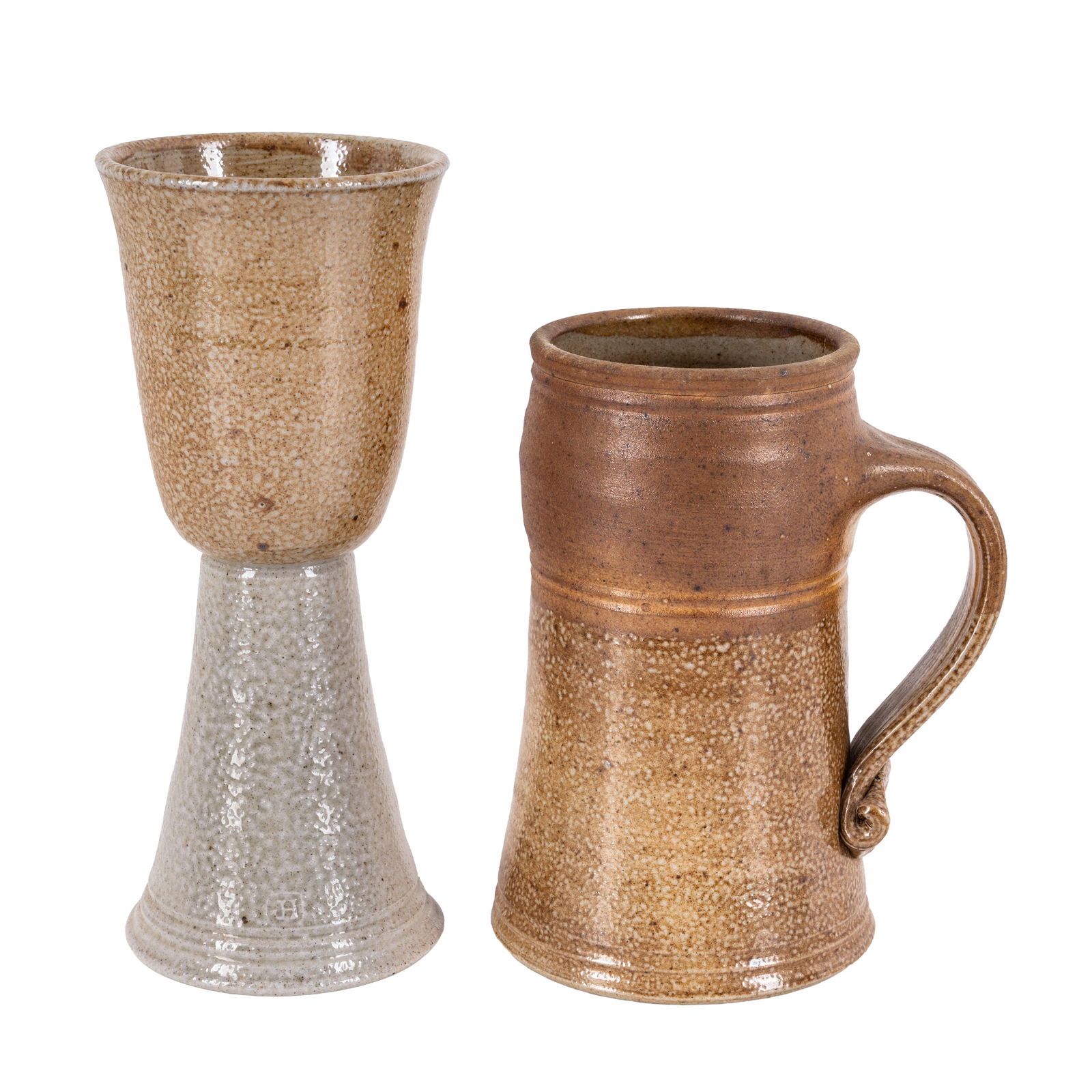 Jane Hamlyn (British b.1940) Studio Pottery: A large tankard with thick strap handle and a goblet Salt-glazed stoneware Each impressed artists seal Tankard: 16.3cm high, Goblet: 21cm high