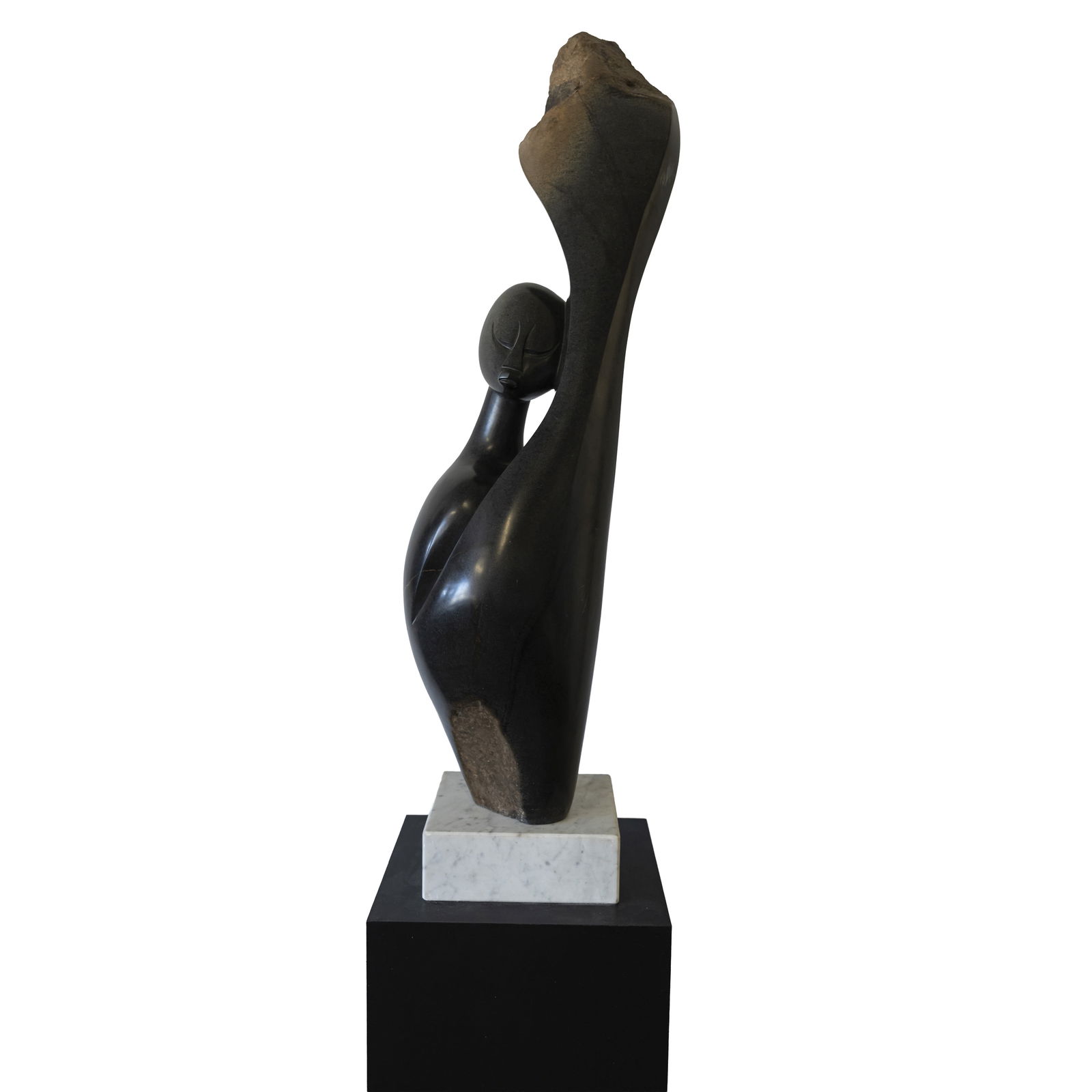Nesbert Mukomberanwa (Zimbabwean b.1969) 'Dreaming' Shona Sculpture: Late 20th/early 21st century Springstone (Serpentine), ebonised wood plinth (full height not seen in images) Incised initials 'N.V.M' Sculpture 87cm high, plinth 97.5cm high