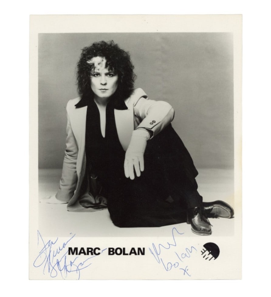 Bolan (Marc) Signed black & white publicity photograph: Bolan (Marc) Signed black & white publicity photograph Rare c. 1976 UK EMI black & white publicity photograph featuring a classic image of Marc, signed and dedicated to Vivian by Gloria Jones