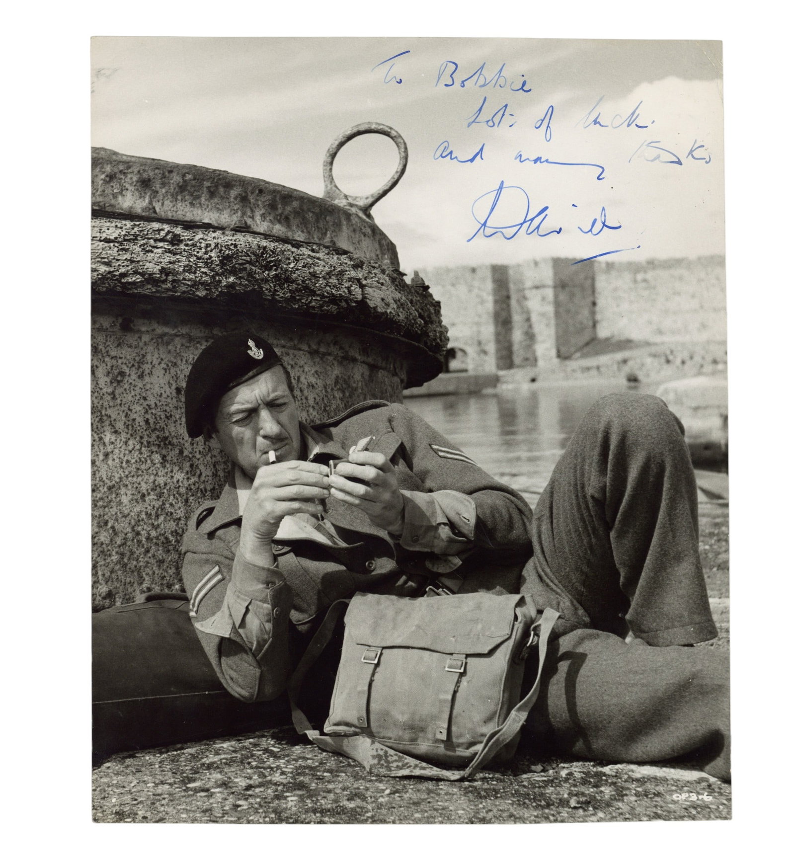 Niven (David) Signed photograph: Niven (David) Signed photograph Glossy black and white photograph of David Niven from 'The Guns of Navarone' (1961), signed and inscribed in blue ink "To Bobbie, Lots of luck and many thanks, David",
