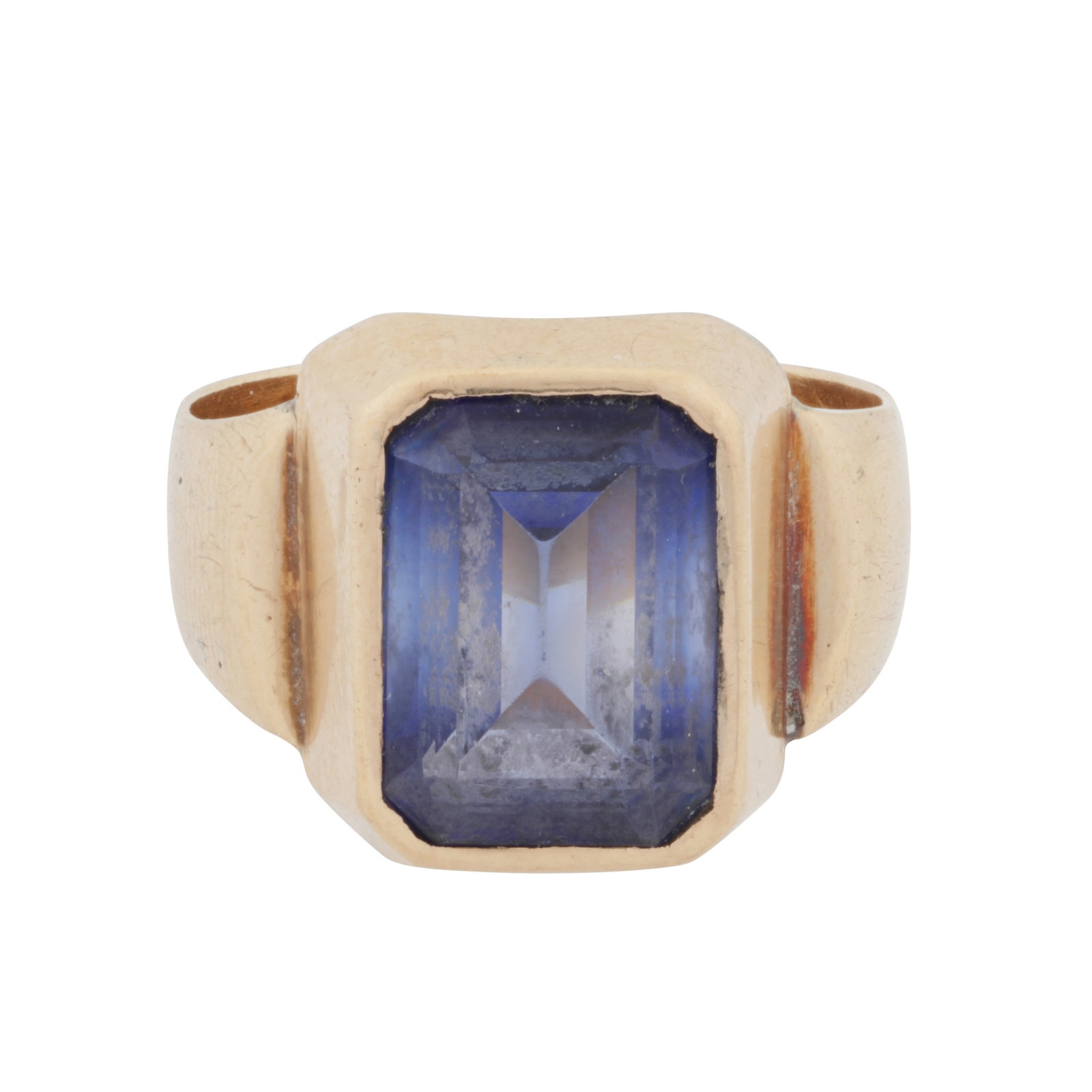 A synthetic sapphire ring Yellow metal: A synthetic sapphire ring Yellow metal Collet-set with an octagonal step-cut synthetic sapphire, to a polished yellow mount, Austro-hungarian mark, ring size W