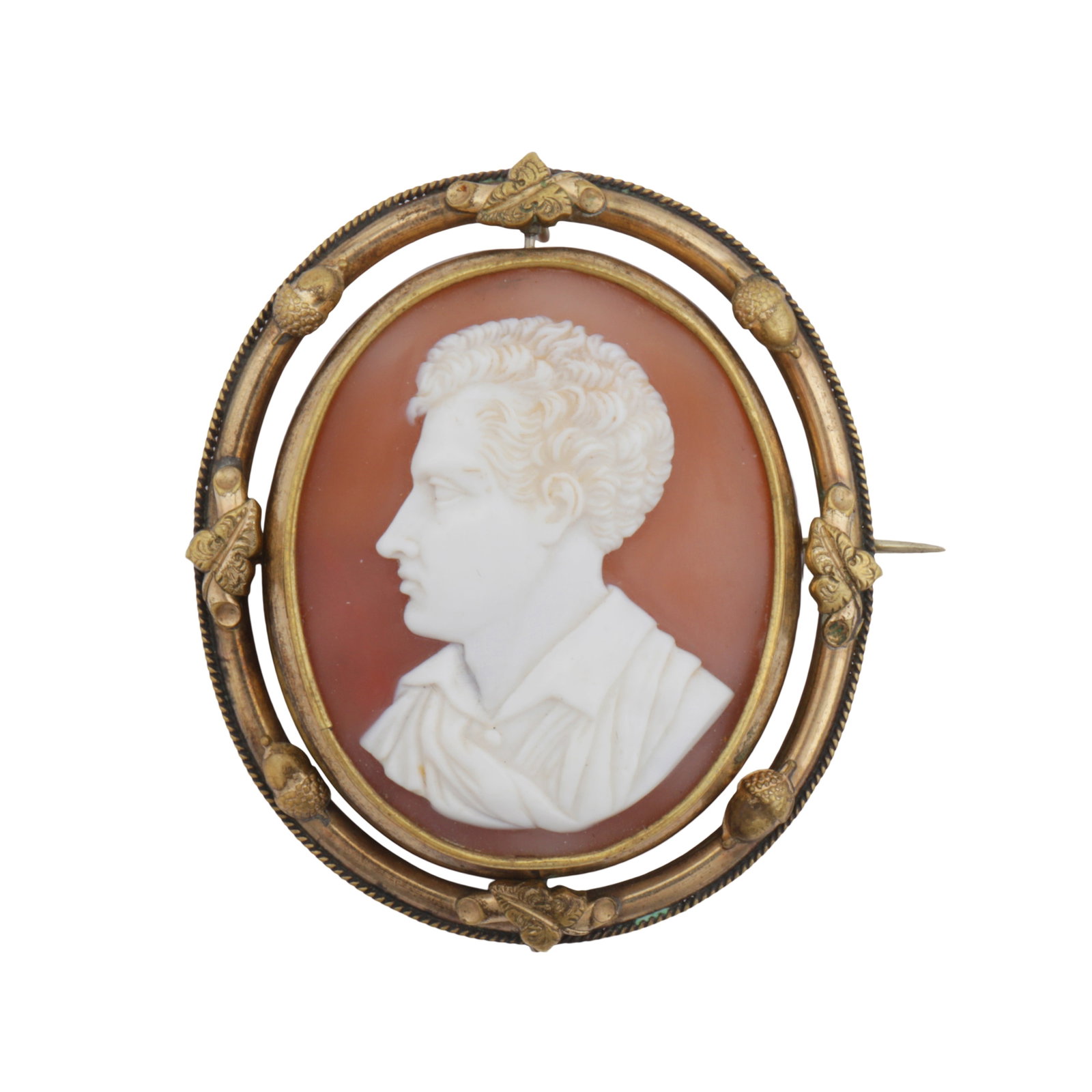 A cameo brooch / pendant Yellow metal: A cameo brooch / pendant Yellow metal Depicting Lord Byron, of swivel design, to a glazed compartment; within a border decorated with foliate and acorn details; length 6.5cm The item has been XRF test