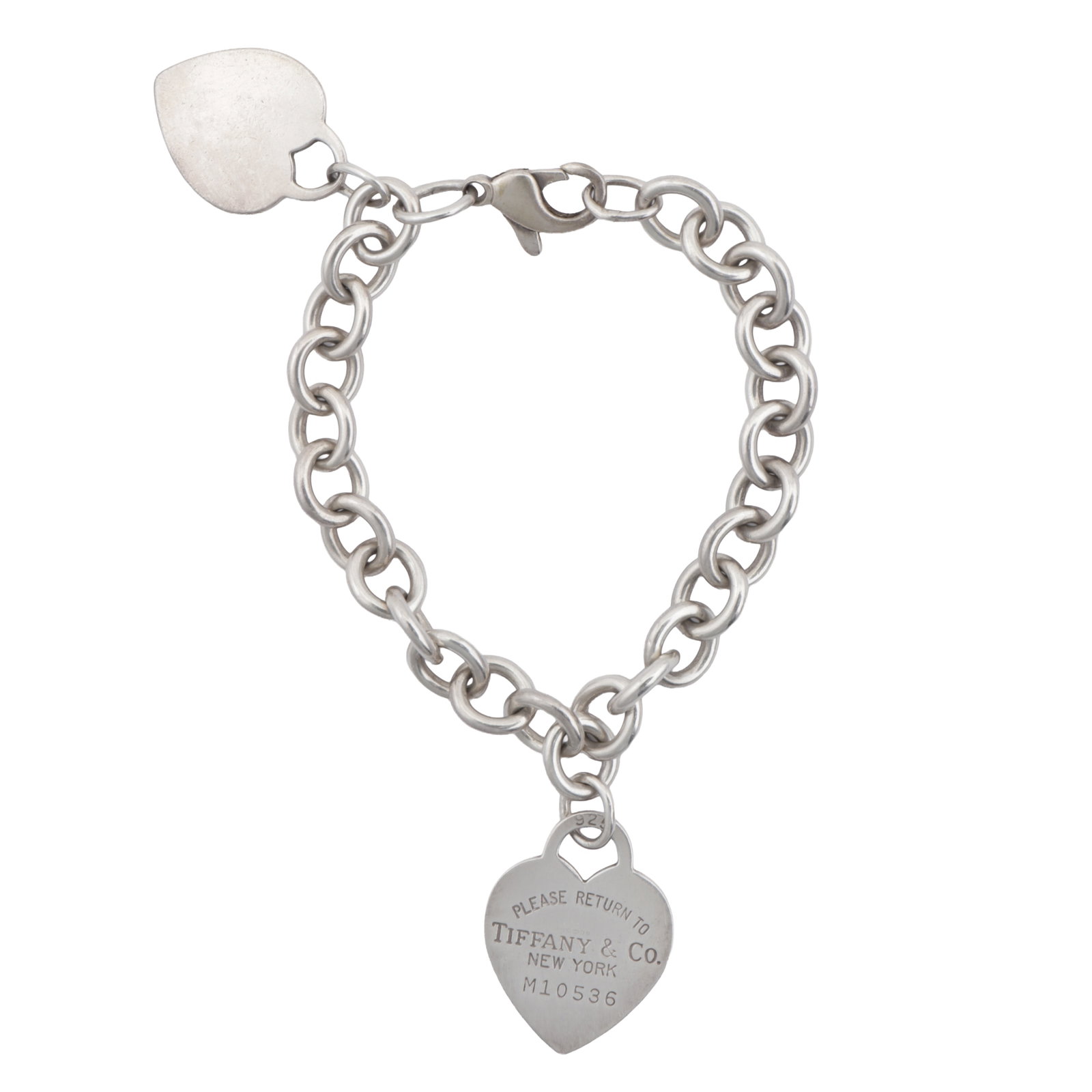 Tiffany & Co Ι A 'Return to Tiffany' bracelet White metal: Tiffany & Co Ι A 'Return to Tiffany' bracelet White metal A cable-link bracelet with two heart-shaped tabs, inscribed Please Return To Tiffany and Co. New York, stamped 925, length 18.0cm,