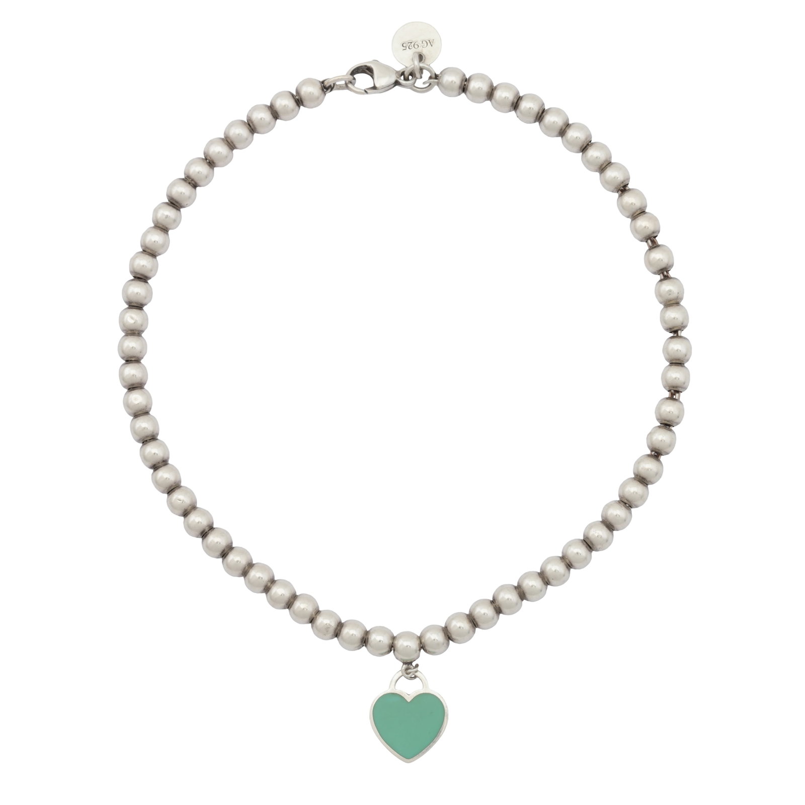 Tiffany & Co. | A 'Return to Tiffany' enamel heart bracelet White metal: Tiffany & Co. | A 'Return to Tiffany' enamel heart bracelet White metal The bead-link chain with lobster clasp, suspending a heart-shaped charm decorated with green enamel, inscribed 'Please Return To