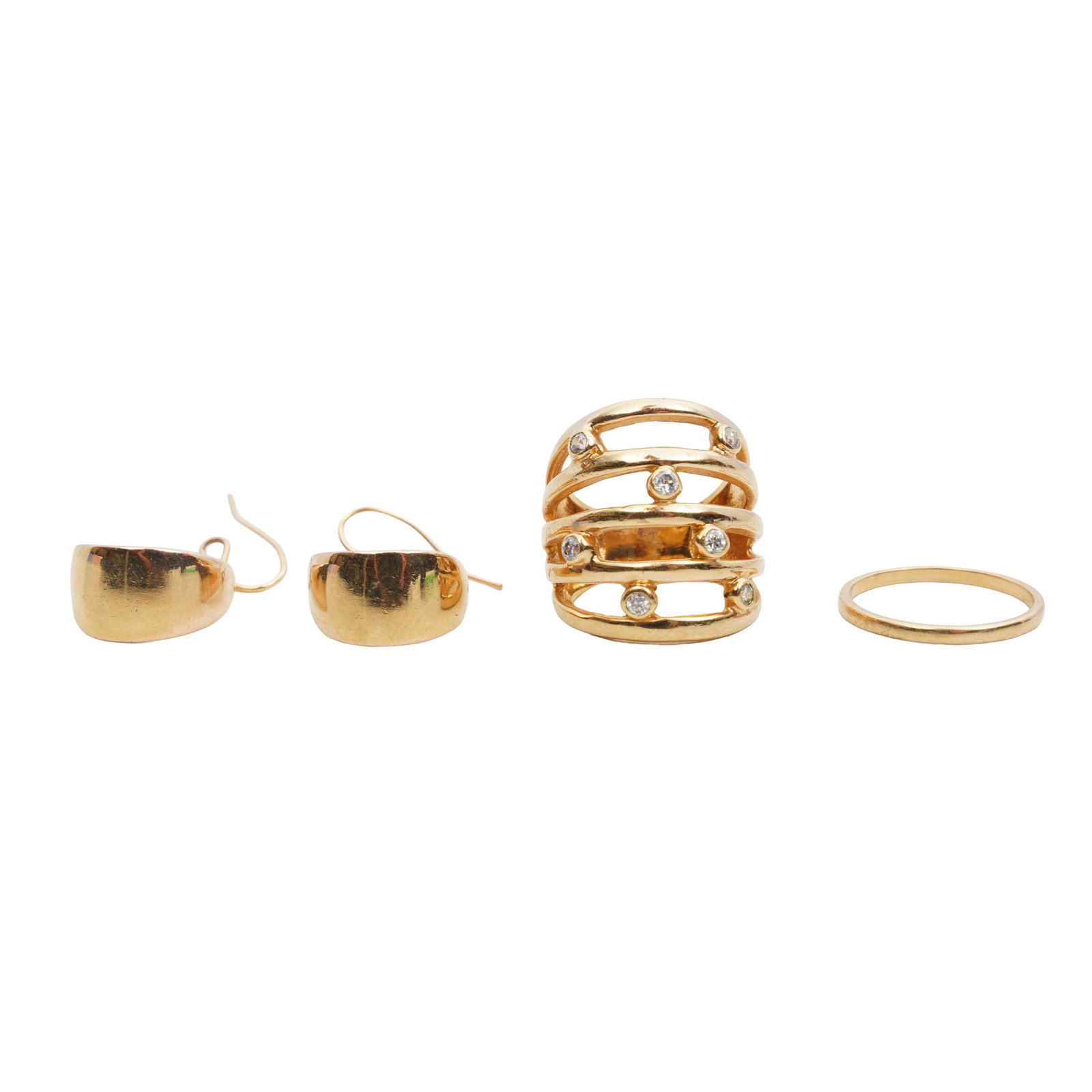 A group of jewellery Yellow metal: A group of jewellery Yellow metal Including two rings and a pair of earrings, all set in yellow metal; unmarked; various sizes (3) The items have been XRF tested and found to be the band 18ct gold,