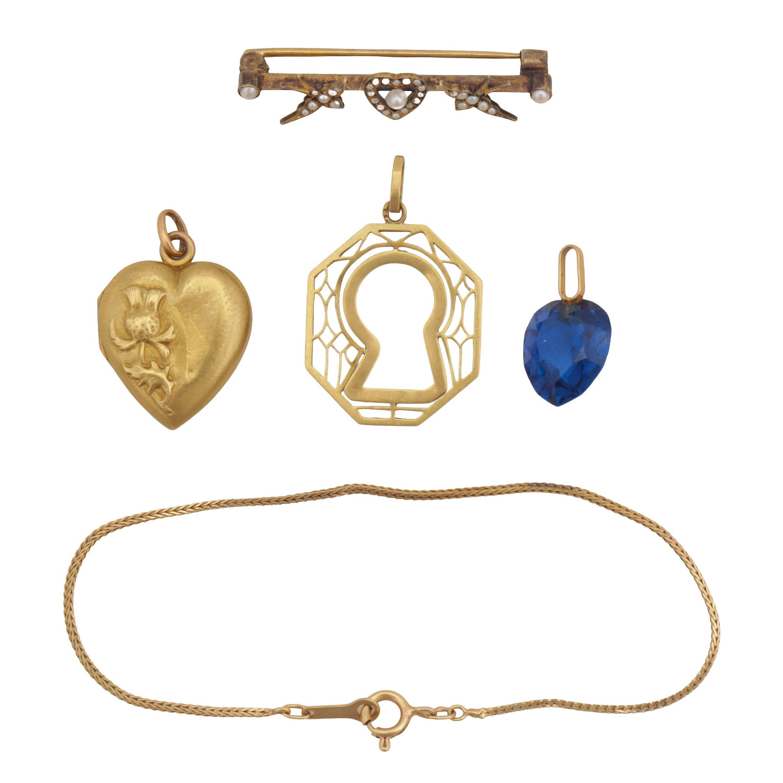 A group of jewellery Yellow metal: A group of jewellery Yellow metal Including a heart pendant, unmarked; a pierced pendant, unmarked; a blue stone heart pendant, unmarked; a chain bracelet set in 9 carat gold, UK hallmark; and a seed 