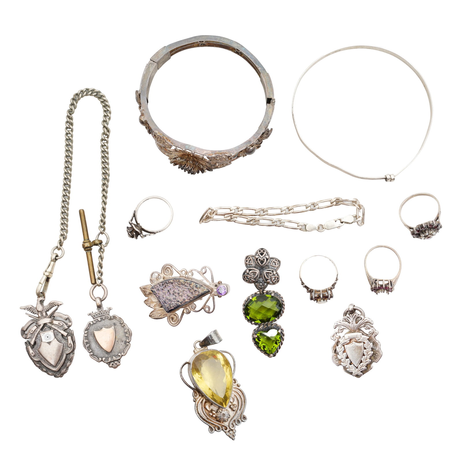 A group of silver jewellery White metal: A group of silver jewellery White metal To include four pendants, a bracelet, two bangles, four rings, and an Albert chain; some set with gemstones such as garnet, opal, amethyst, and citrine; some