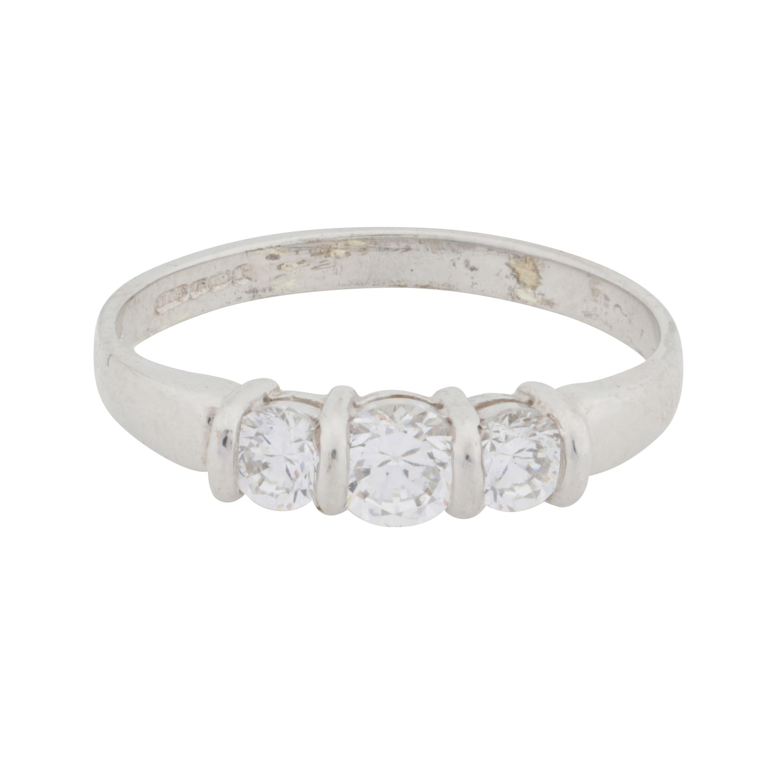 A three-stone diamond simulant ring 9 carat white gold: A three-stone diamond simulant ring 9 carat white gold Set with graduated circular-cut cubic zirconia, mounted in 9 carat white gold, UK hallmark, ring size N½