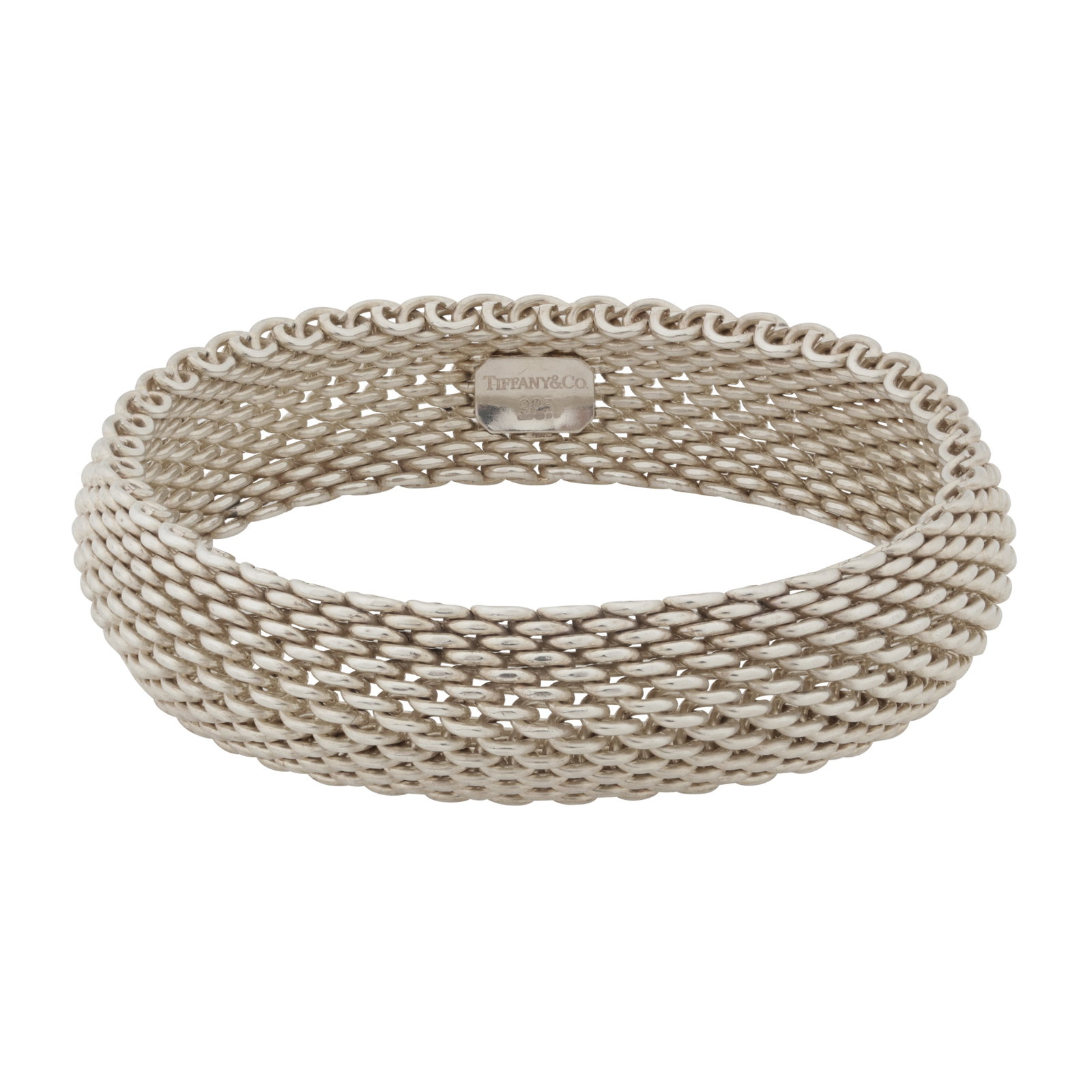 Tiffany & Co. | A Somerset mesh bracelet Silver: Tiffany & Co. | A Somerset mesh bracelet Silver The wide soft bracelet, with a logo plaque in the inner band, signed Tiffany, maker's mark, UK hallmark, inner diameter 6.5cm