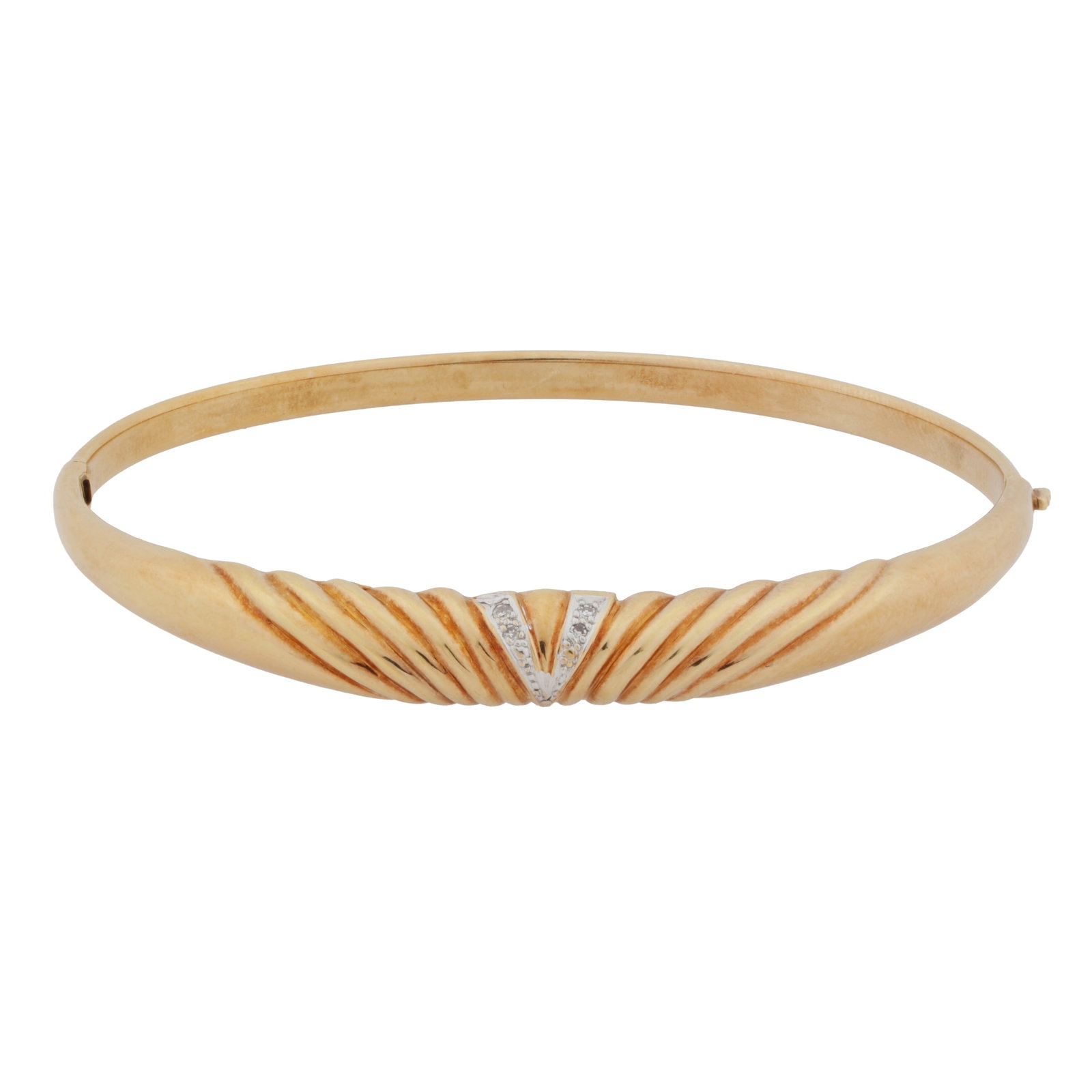 A diamond bangle Yellow metal: A diamond bangle Yellow metal Of hinged design set with pavé-set diamonds to a diagonally reeded front, with push clasp, stamped 585, Inner diameter 5.9cm