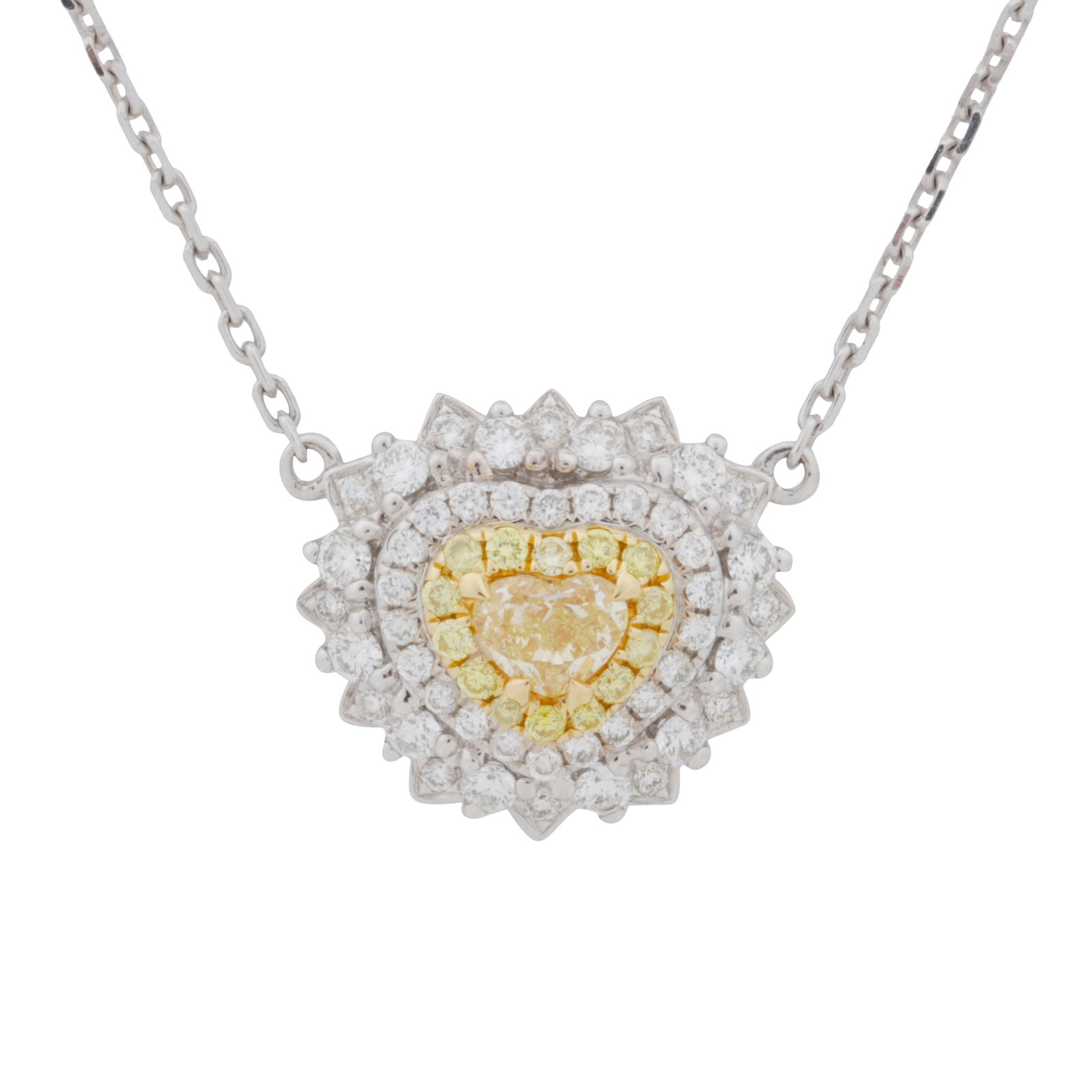 A yellow and white diamond pendant necklace White metal: A yellow and white diamond pendant necklace White metal Of heart shape, set throughout with brilliant-cut and yellow circular-cut diamonds, mounted in white and yellow metal, to a fine cable link
