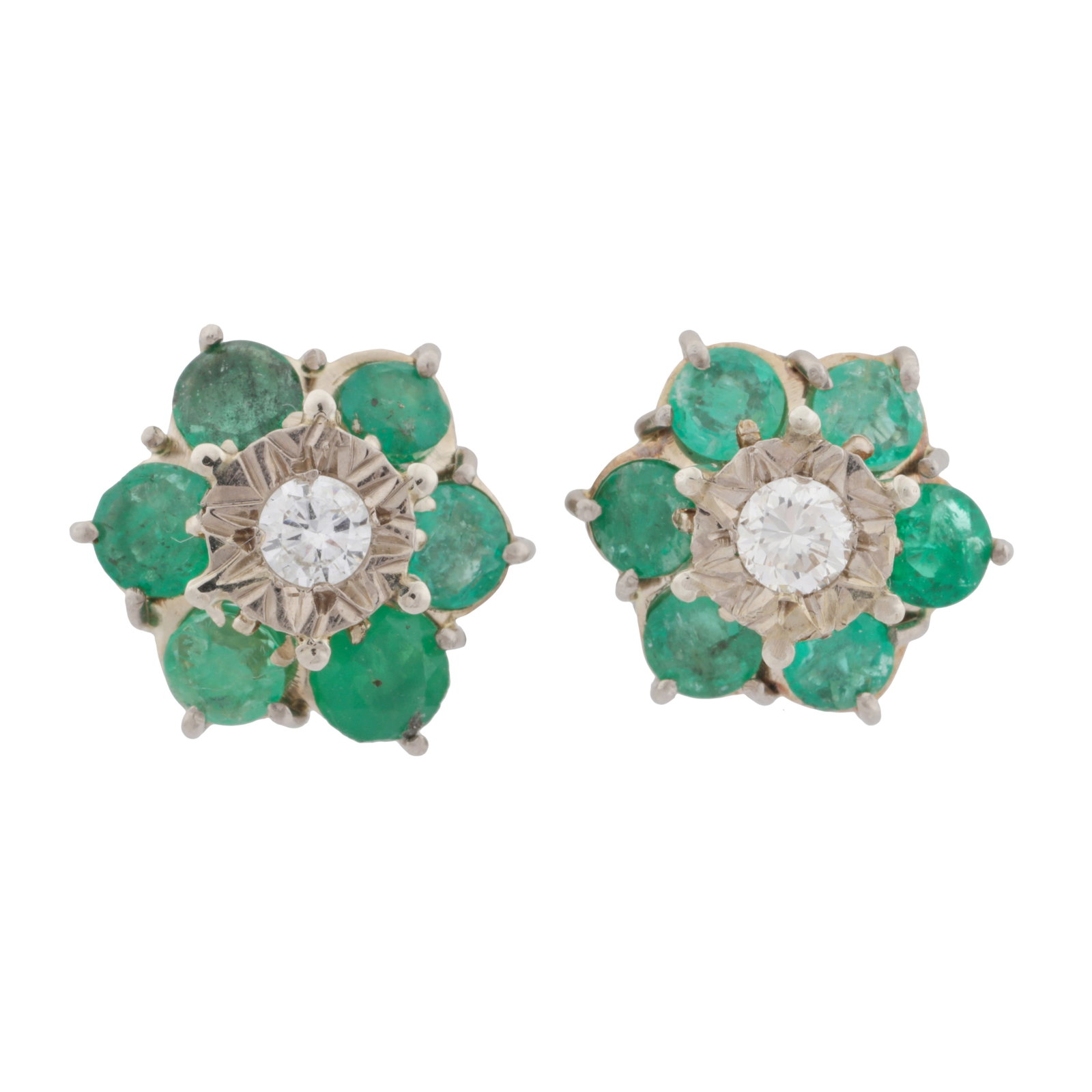 A pair of emerald and diamond flower earrings White metal: A pair of emerald and diamond flower earrings White metal Of stud design, centrally star-set with a brilliant-cut diamond, surrounded by circle-cut emeralds, post and butterfly fittings, stamped 750, 