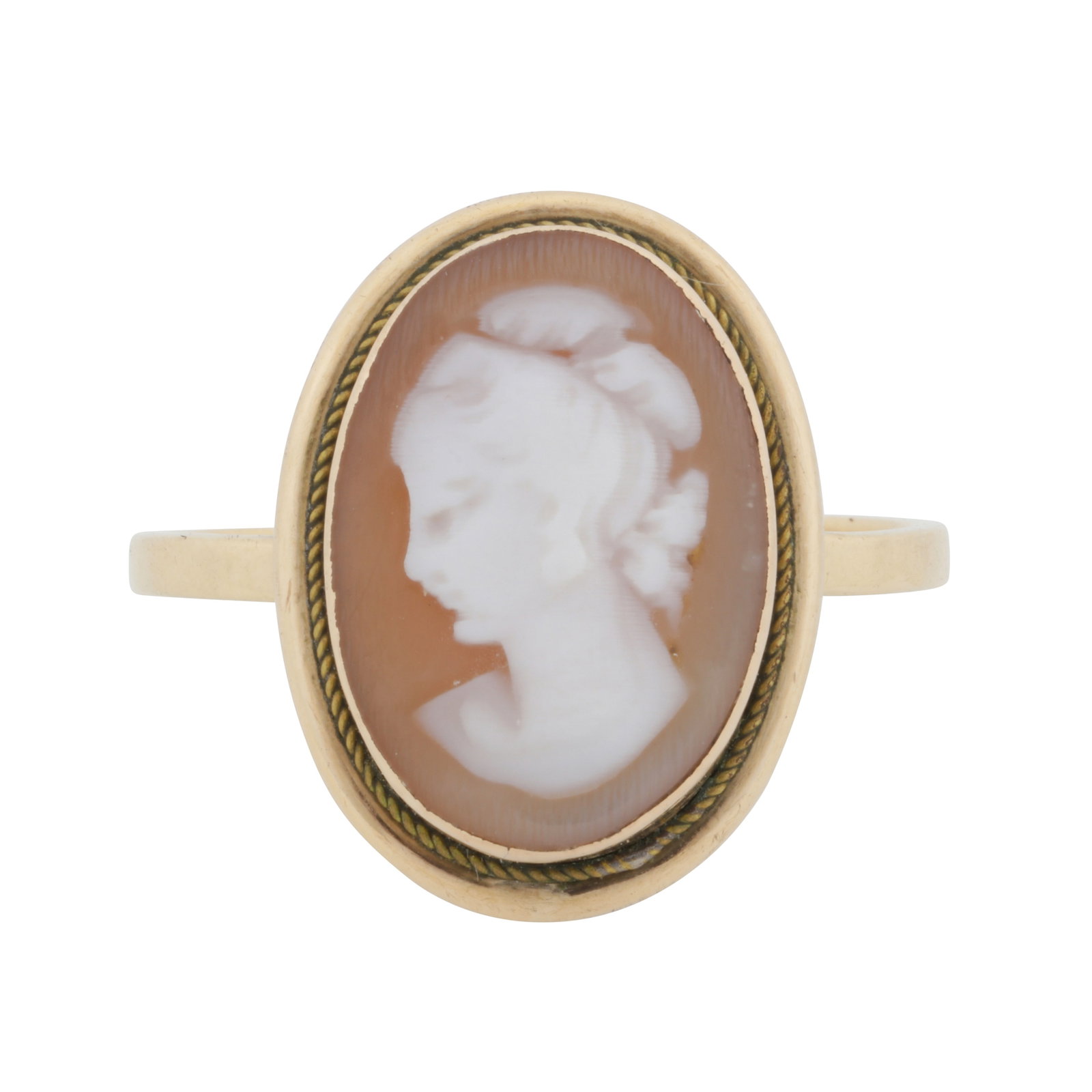 A cameo ring Yellow metal: A cameo ring Yellow metal The collet-set oval-shaped cameo, featuring a lady's profile looking left, to a rope-twist decorated border, straight band, stamped 750, size M