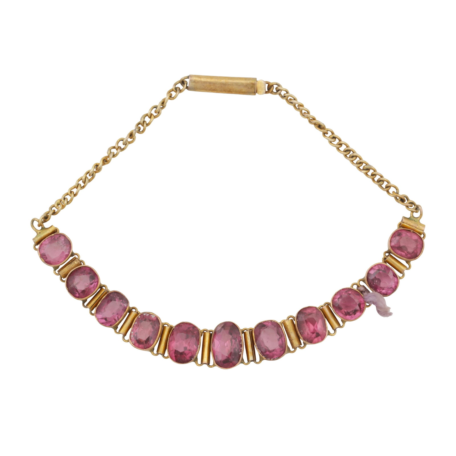A garnet line bracelet Yellow metal: A garnet line bracelet Yellow metal The curb-link chain bracelet, mounting a row of graduated oval-cut garnets (one broken link), to a barrel clasp, unmarked, length 17.7cm The item has been XRF