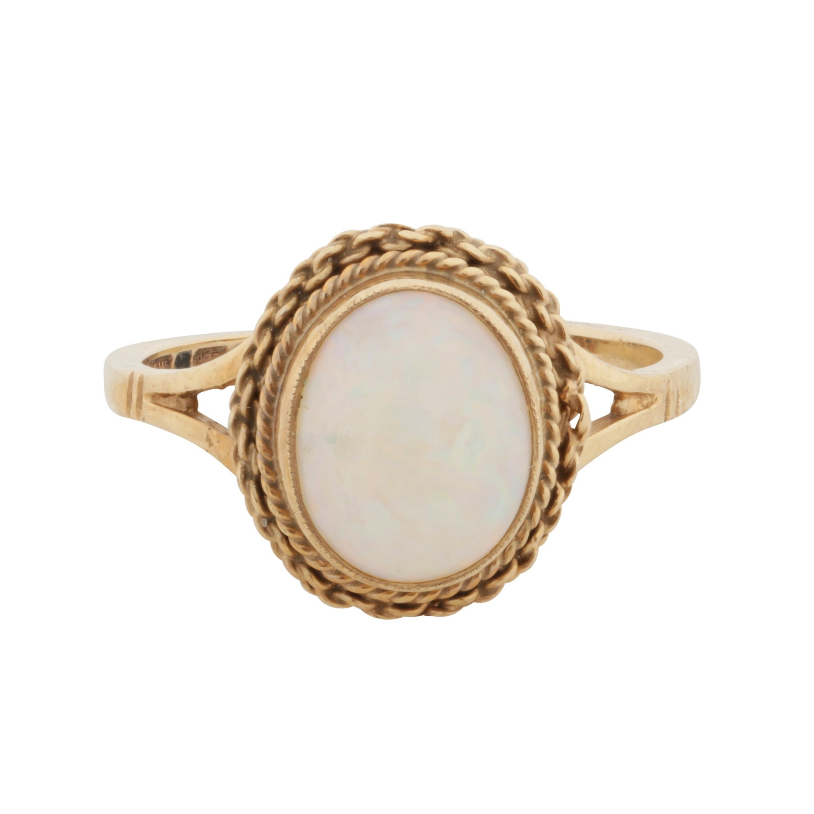 An opal ring, circa 1980 9 carat yellow gold: An opal ring, circa 1980 9 carat yellow gold Centrally set with an oval opal cabochon, to a rope twist and fancy-link double surround, mounted in 9 carat gold, UK hallmark, ring size P