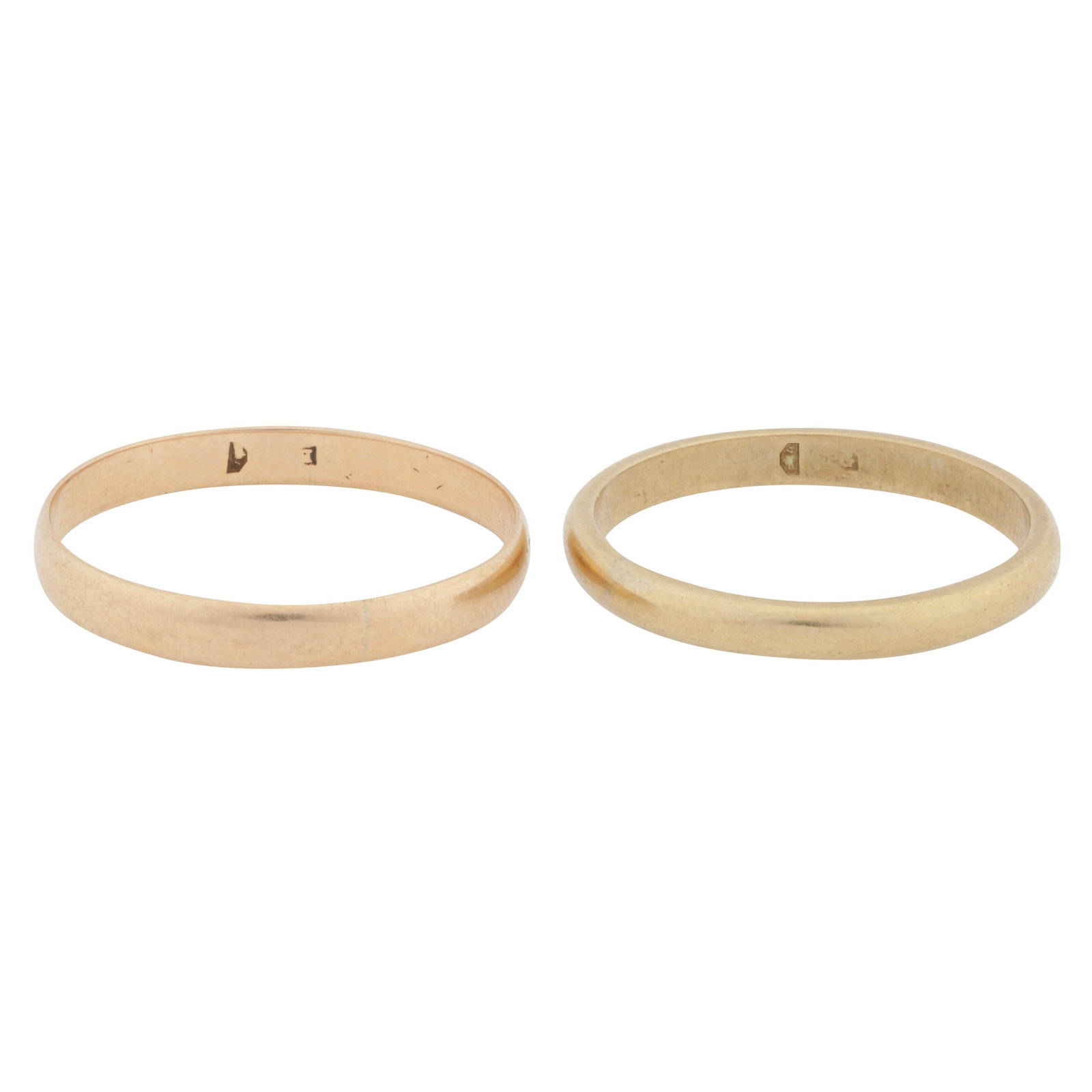 Two band rings Yellow metal: Two band rings Yellow metal Of polished finish, set in yellow metal, Hungarian assay marks, ring sizes R½ & U½ (2)