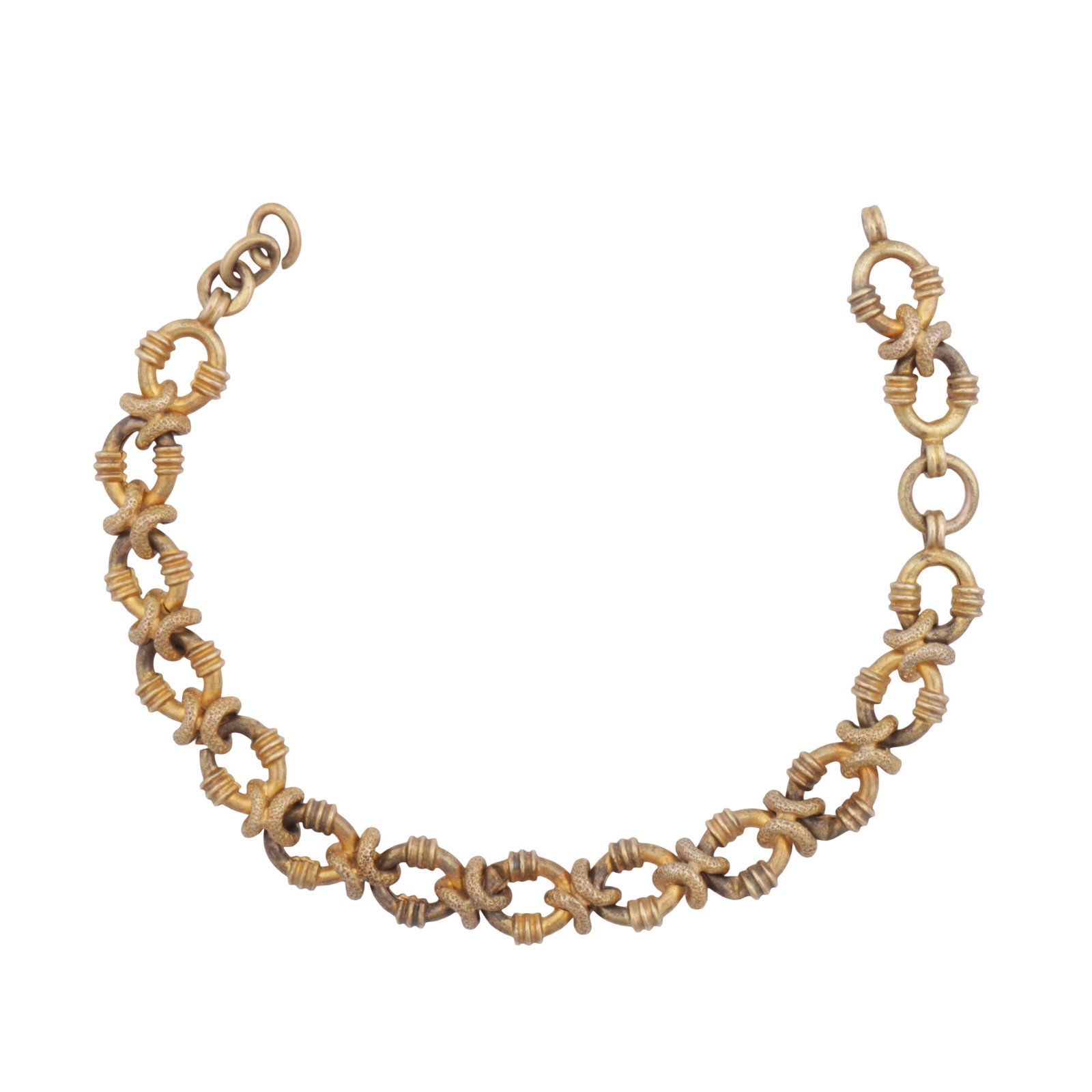 A fancy-link bracelet Yellow metal: A fancy-link bracelet Yellow metal Alternating oval reeded links with textured links, set in yellow metal, clasp deficient, unmarked, length 15.0cm The item has been XRF tested and found to be 18ct go