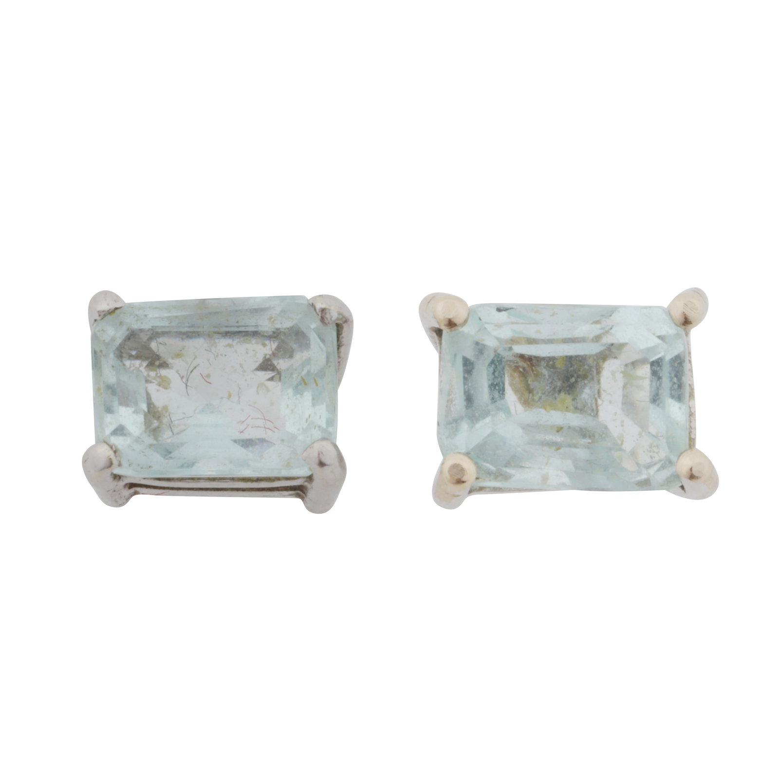 A pair of aquamarine earrings White metal: A pair of aquamarine earrings White metal Each set with octagonal step-cut aquamarines, to an 18 carat white gold mount, UK hallmark, post fittings, length 0.6cm
