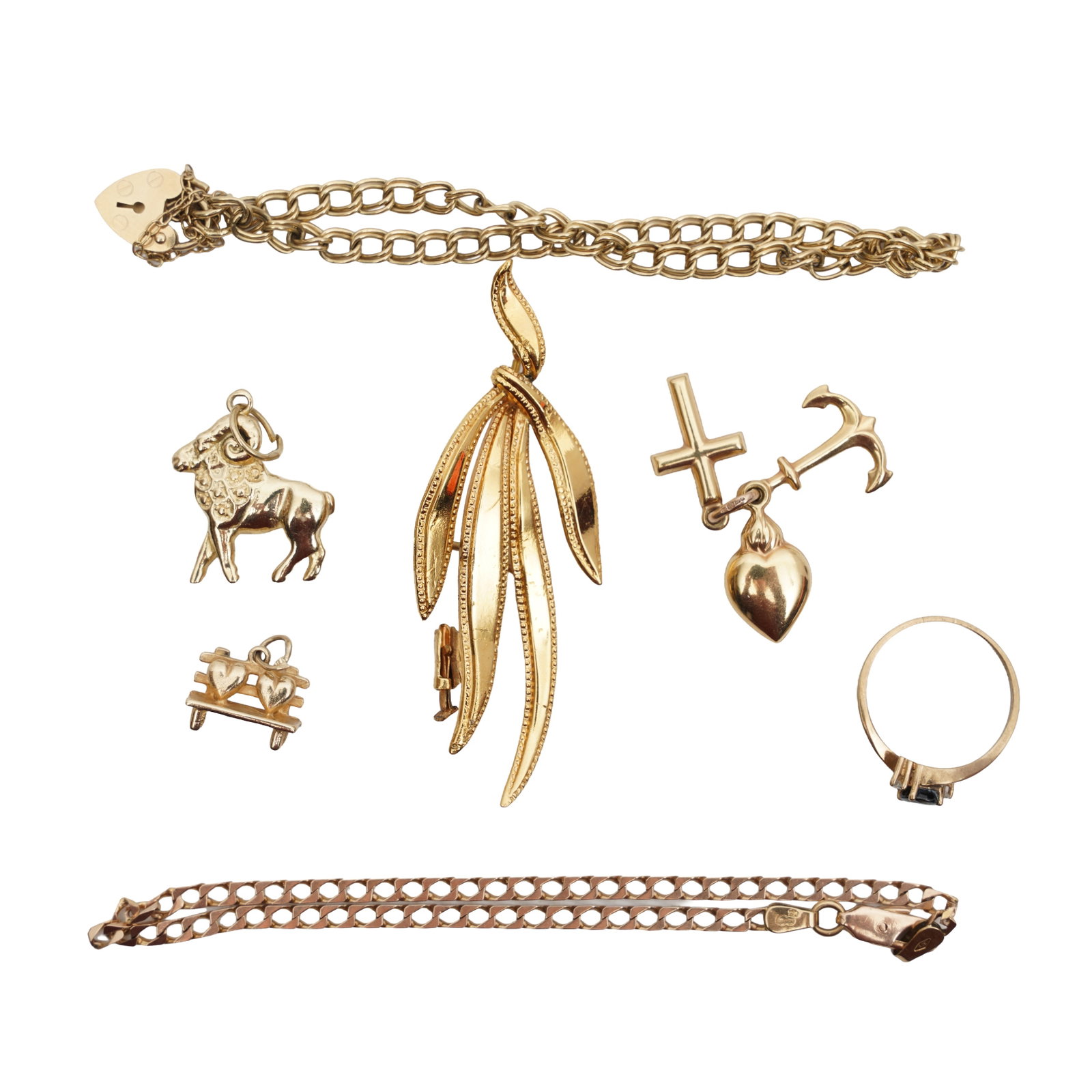A group of jewellery Yellow metal: A group of jewellery Yellow metal To include two link-chain bracelets including one stamped 375 and one set in 9 carat gold; a three-stone sapphire and diamond ring, mounted 9 carat yellow gold and