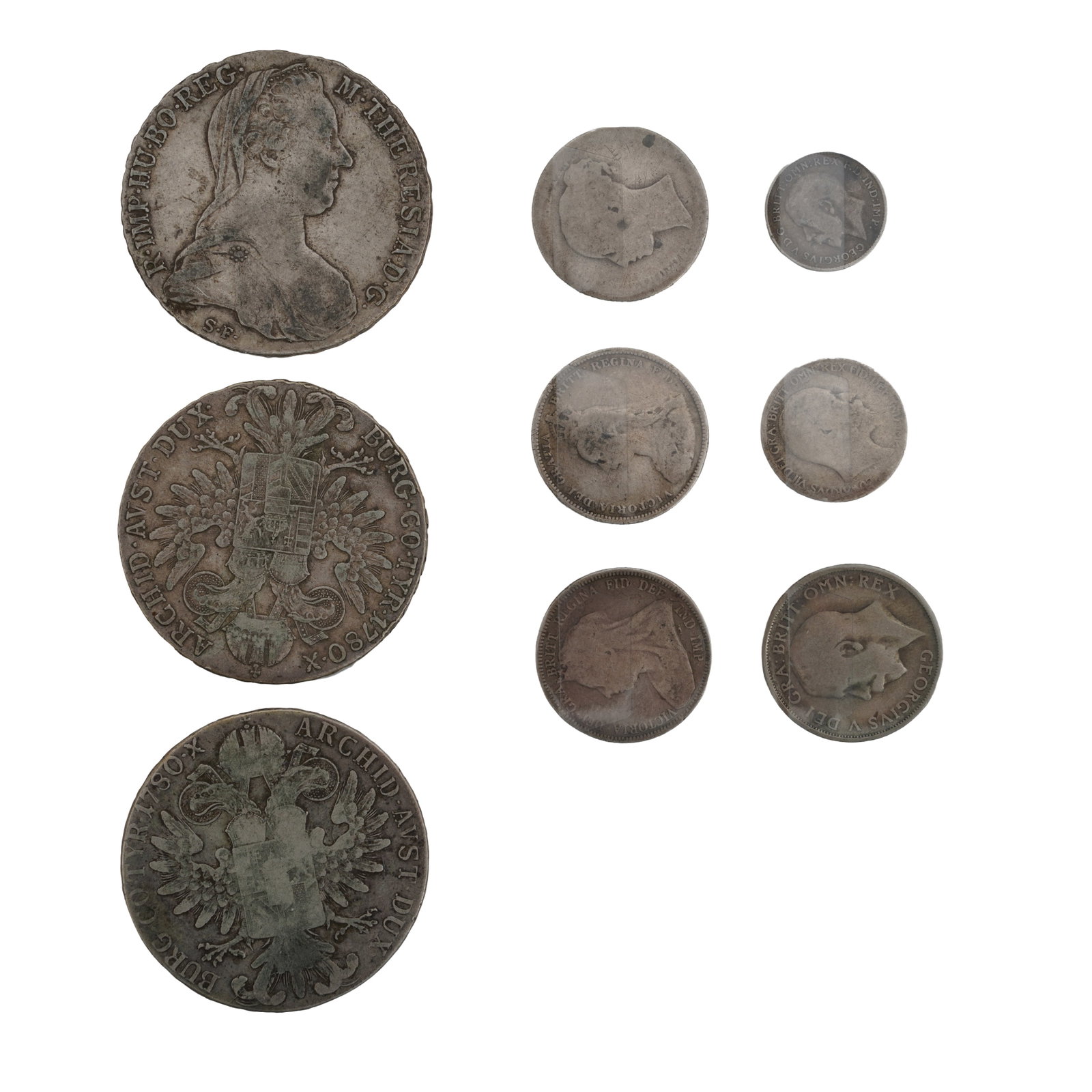 A mixed group of silver coins to include GB examples.: A mixed group of silver coins to include GB examples. The group to include a 1887 Queen Victoria Half Crown, 1913 George V Florin, 1889 Queen Victoria Florin. 1890 Queen Victoria Crown, 1935 George V