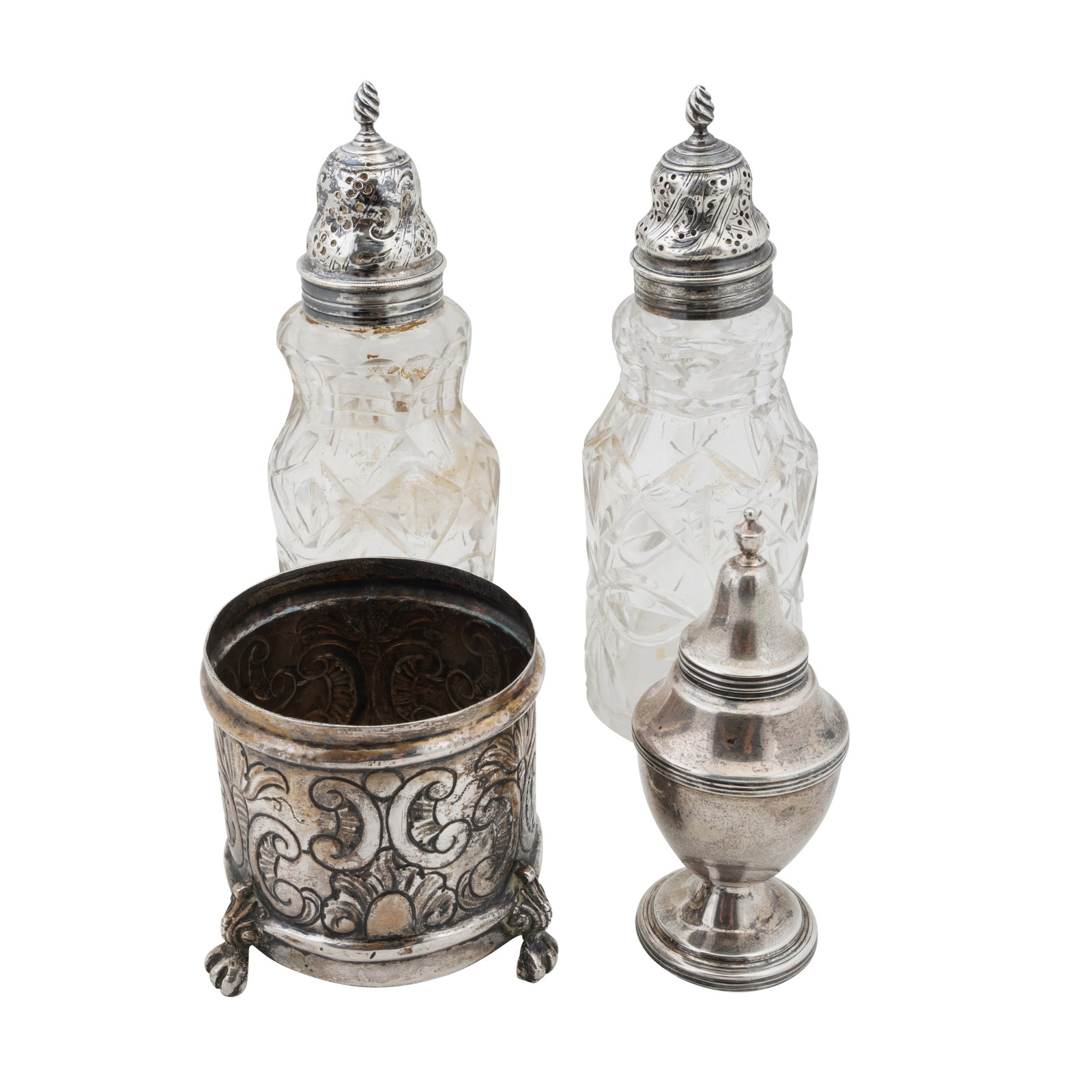 London circa 1770 A pair of George III unmarked silver topped glass casters: London circa 1770 A pair of George III unmarked silver topped glass casters Together with an early 20th century continental table lighter, of vase form. Also to include a white metal jar base. (4)