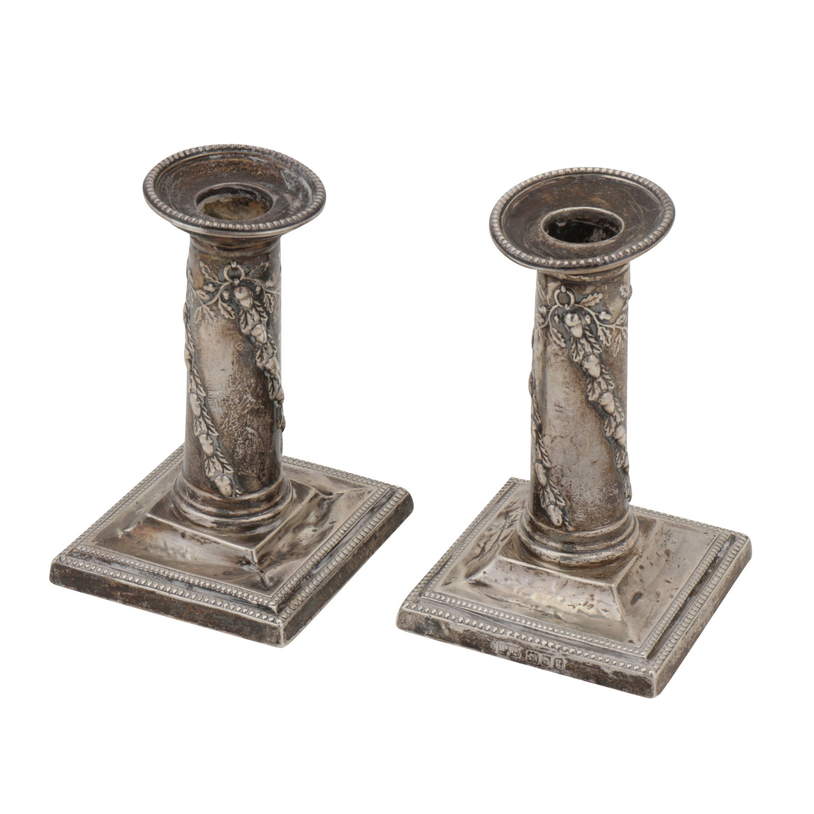London 1902 by Mappin and Webb A pair of Edwardian sterling silver dwarf candlesticks: London 1902 by Mappin and Webb A pair of Edwardian sterling silver dwarf candlesticks Square base with cylindrical columns, with removable beaded sconces. Filled. Each fully marked. (2) Height