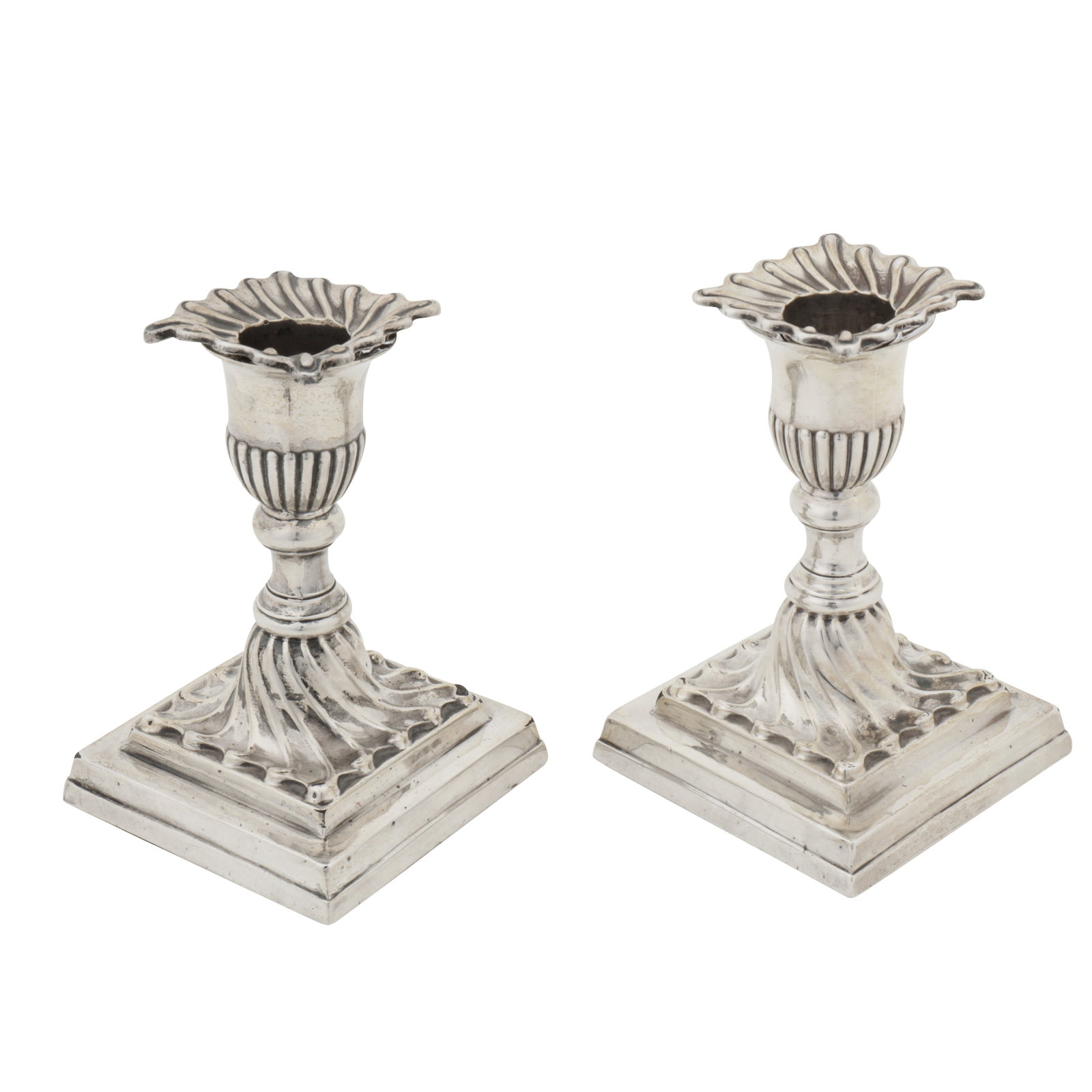 Sheffield 1887 by Hawksworth and Eyre and Co A pair of Victorian sterling silver dwarf candlesticks: Sheffield 1887 by Hawksworth and Eyre and Co A pair of Victorian sterling silver dwarf candlesticks On square bases with wrythen columns. Removable sconces. Fully marked. Filled. (2) Height - 11.5 cm