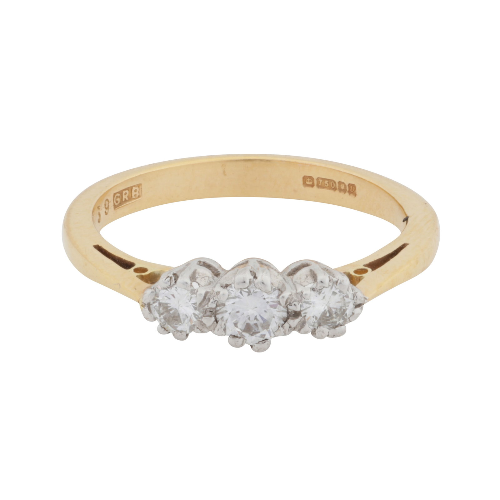 A three-stone diamond ring 18 carat yellow and white gold: A three-stone diamond ring 18 carat yellow and white gold Set with graduated brilliant-cut diamonds, mounted in 18 carat yellow and white gold, diamonds approx. 0.35 carat total, UK hallmark, ring
