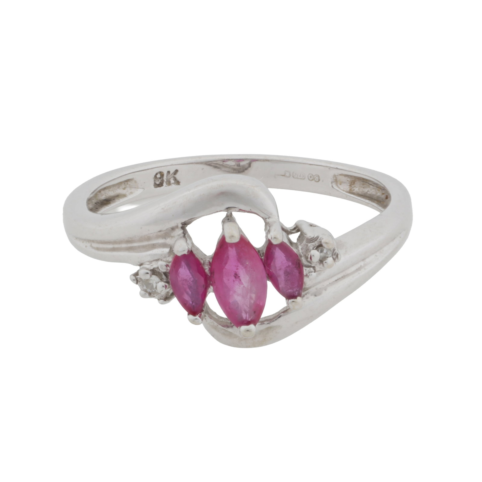 A three-stone ruby ring 9 carat white gold: A three-stone ruby ring 9 carat white gold Centrally set with three graduated marquise-cut rubies, highlighted by a single-cut diamond on each side, set in 9 carat white gold, UK hallmark, ring size