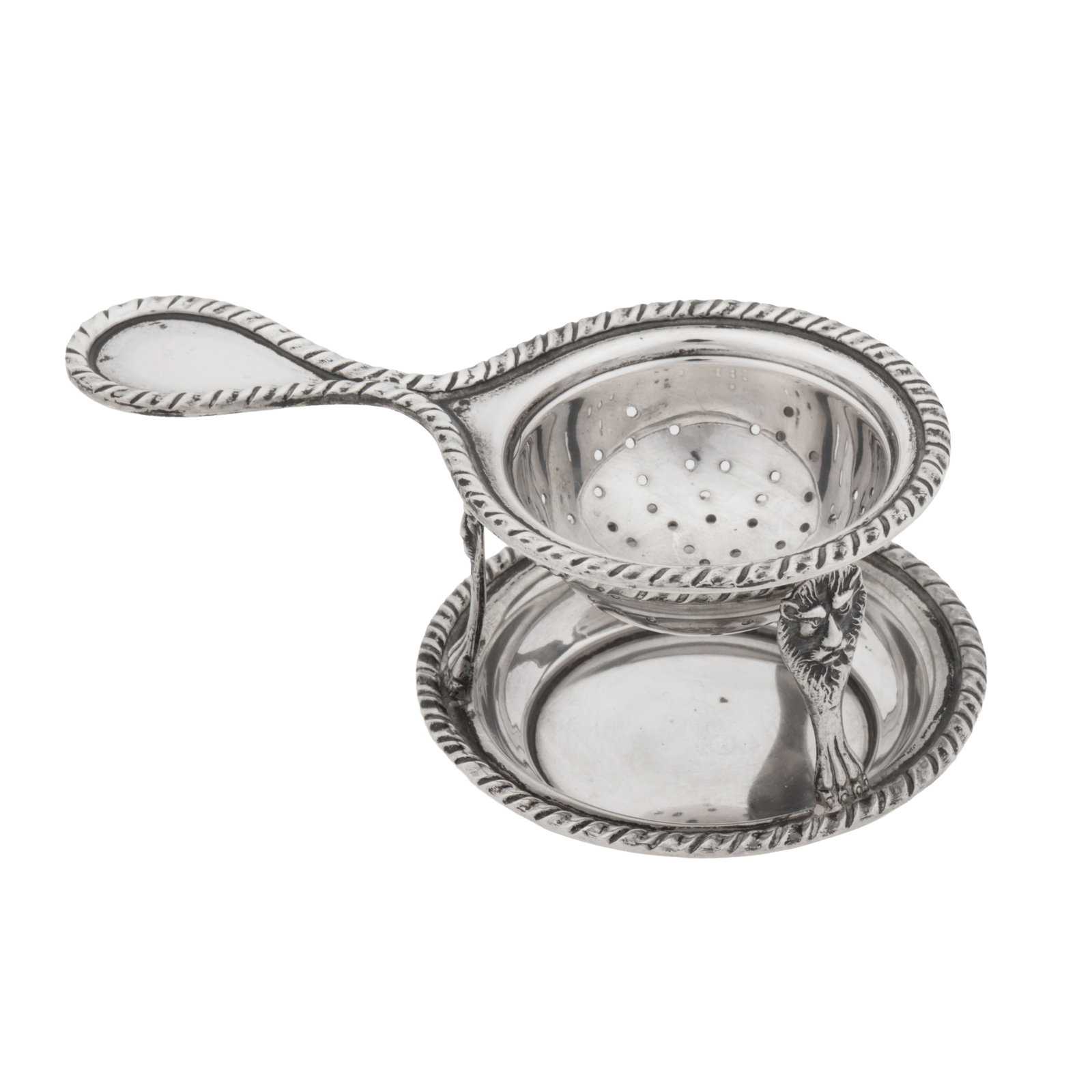 Brescia circa 1960 by Petruzzi and Branca A late 20th century Italian 800 standard silver tea strain: Brescia circa 1960 by Petruzzi and Branca A late 20th century Italian 800 standard silver tea strainer on stand The stand of circular form with lion and paw feet. Edged with ropetwist. Weight - 109