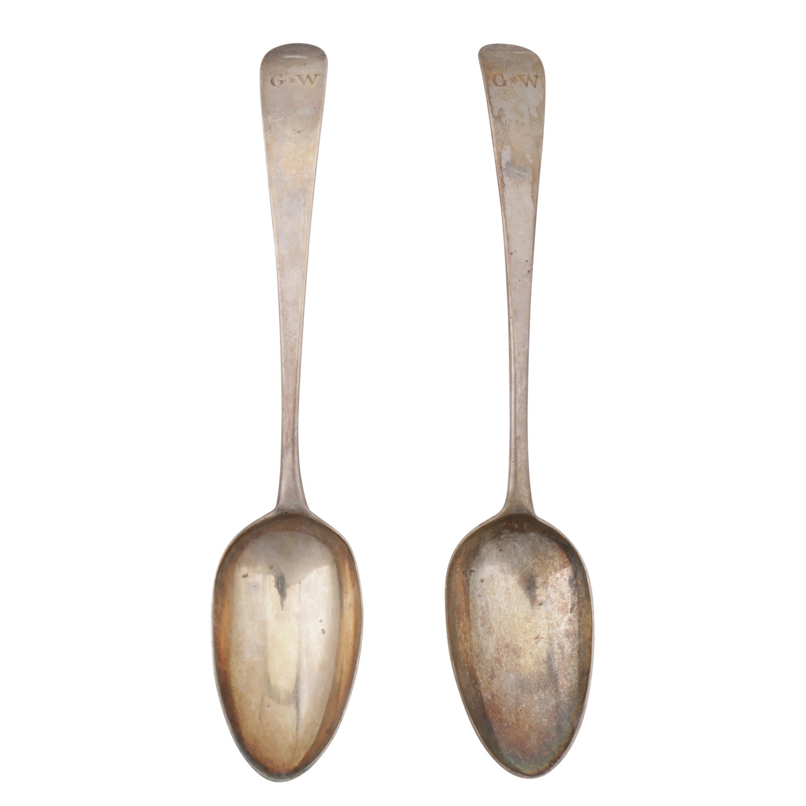 London 1782 by Hester Bateman A pair of George III sterling silver tablespoons: London 1782 by Hester Bateman A pair of George III sterling silver tablespoons Old English pattern, the terminals engraved with initials G*W in Roman script. Each fully marked. (2) Weight – 139