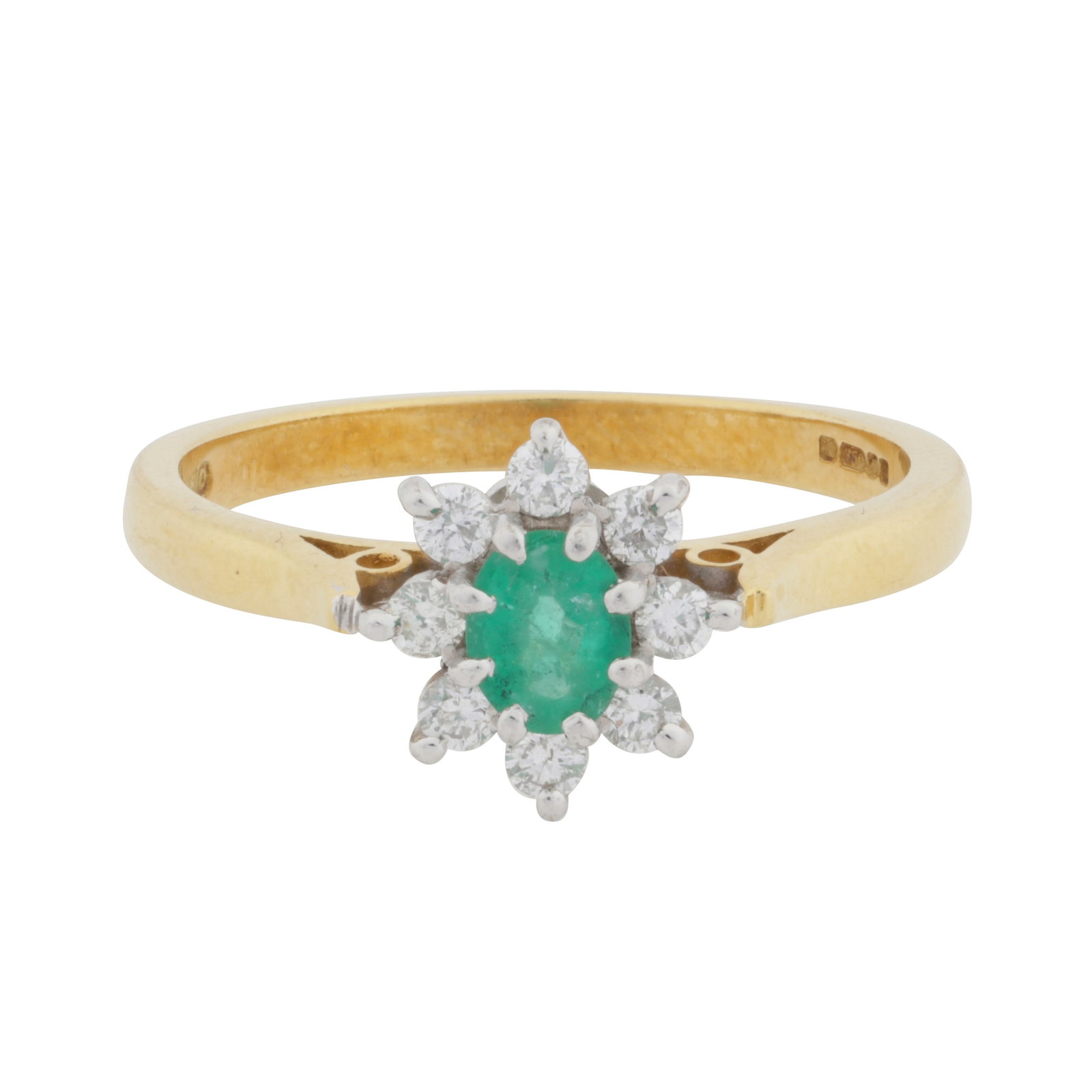 An emerald and diamond cluster ring, circa 2001 18 carat yellow and white gold: An emerald and diamond cluster ring, circa 2001 18 carat yellow and white gold Centrally-set with an oval-cut emerald, to a brilliant-cut diamond surround, mounted in 18 carat yellow and white gold,