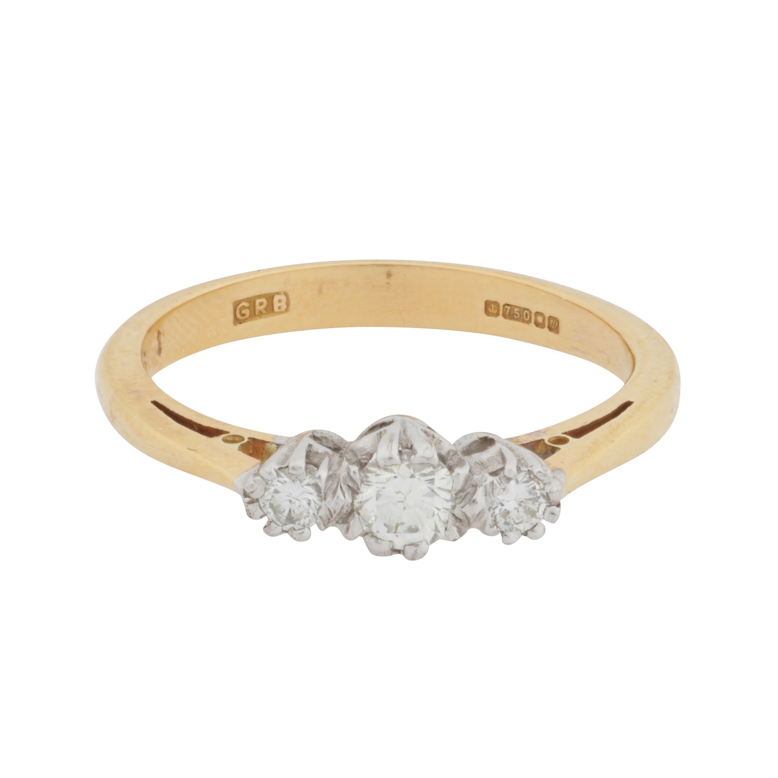 A three-stone diamond ring, circa 1996 18 carat yellow and white gold: A three-stone diamond ring, circa 1996 18 carat yellow and white gold Set with graduated brilliant-cut diamonds, to a 18 carat yellow and white gold mount, maker's mark, UK hallmark, diamonds approx.